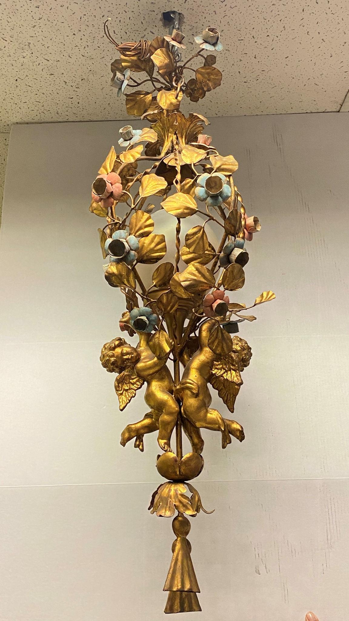 Very nice quality French mid century gilt metal and tole cherub motif chandelier with polychrome painted flowers.