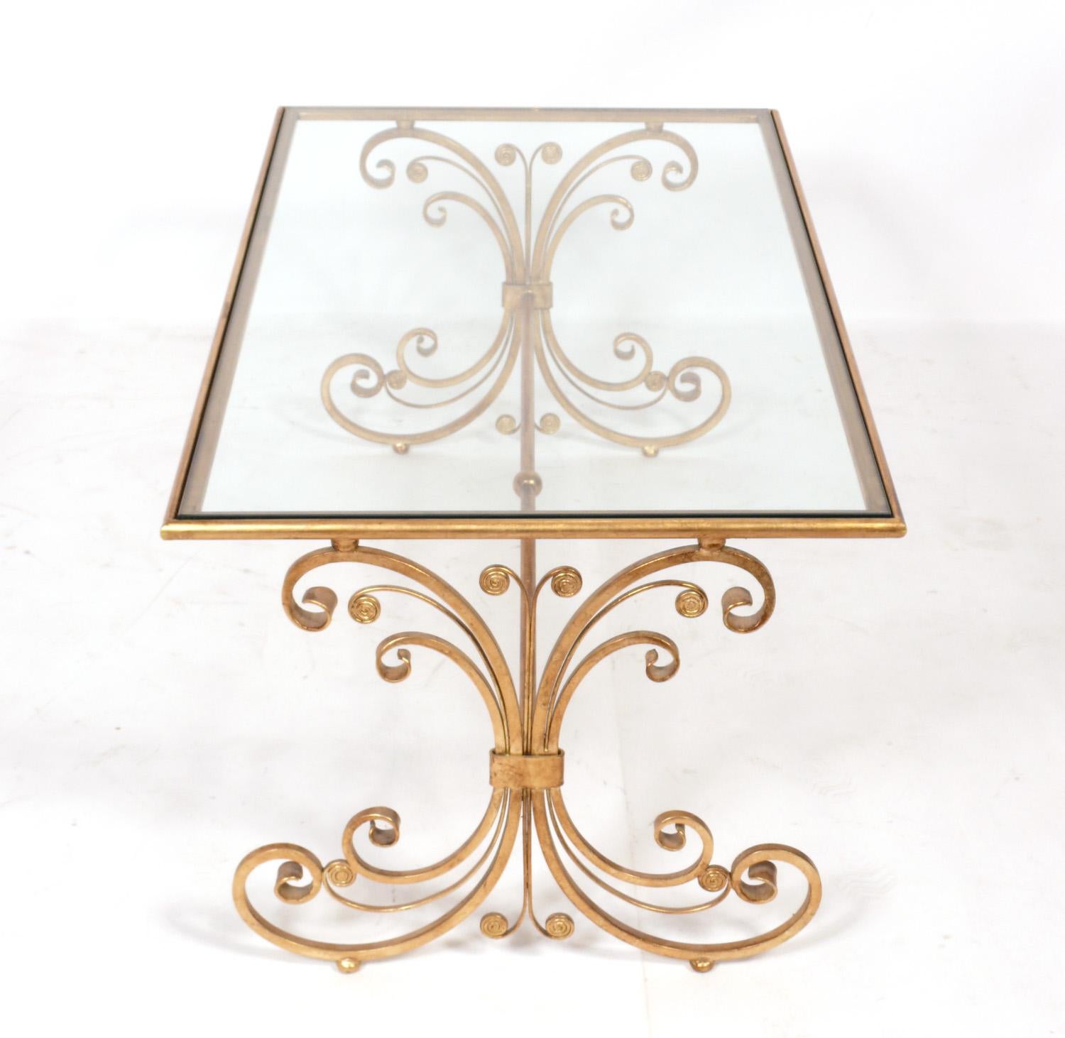 Gilt metal coffee table, late 20th century. Retains wonderful patina to the gilt metal. Solid construction with heavyweight glass top.
