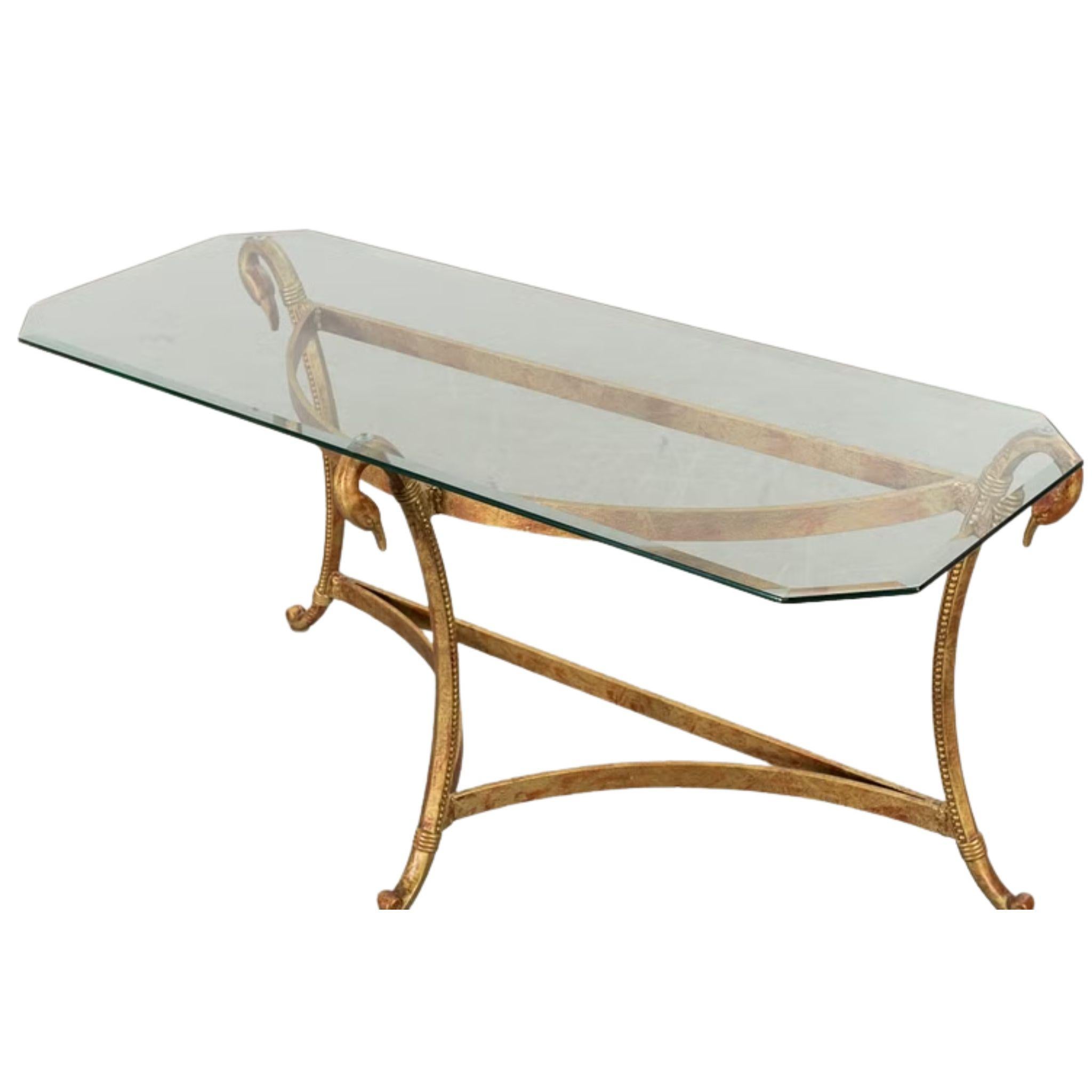 An elegant gilt metal console table from the late twentieth century, featuring a sculptural base with finely worked swan head accents at each corner. The frame is formed with sweeping curved legs joined by shaped stretchers, all finished in a warm,