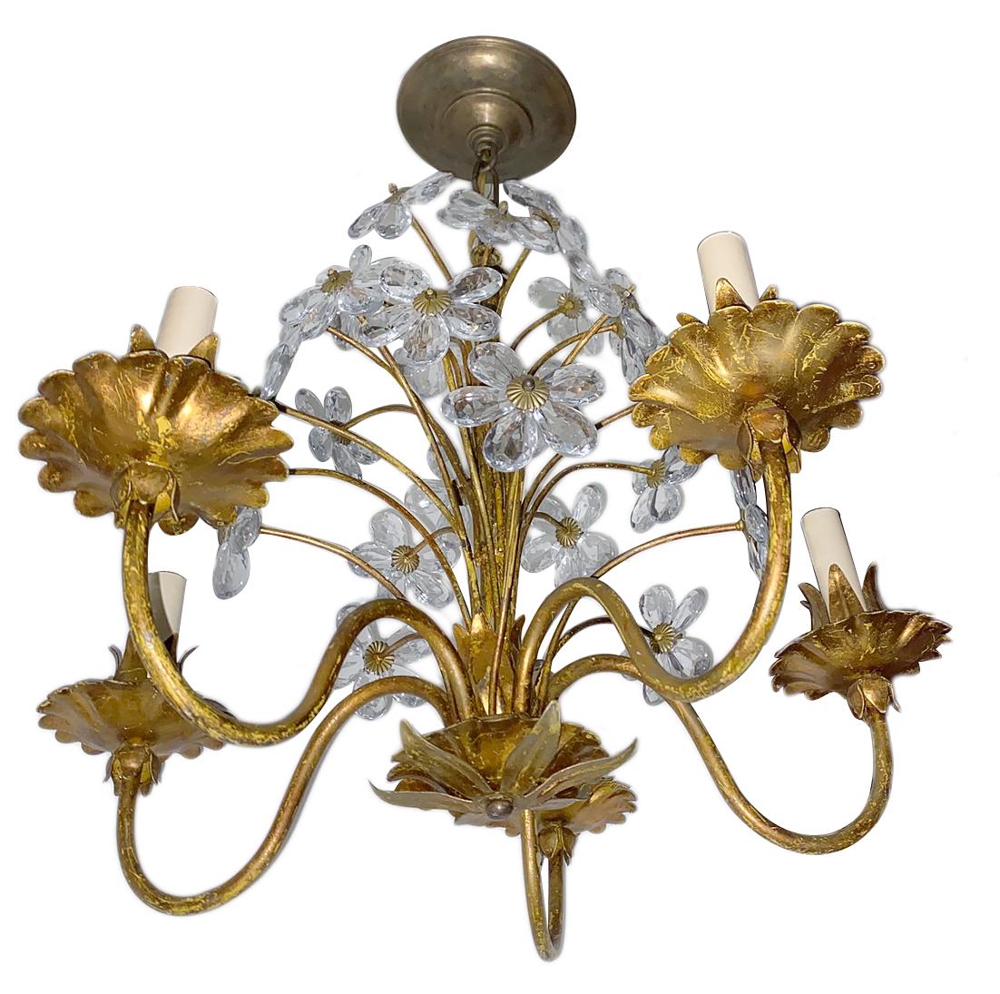 A circa 1930s French gilt metal crystal flower chandelier.
Measurements:
Height 21