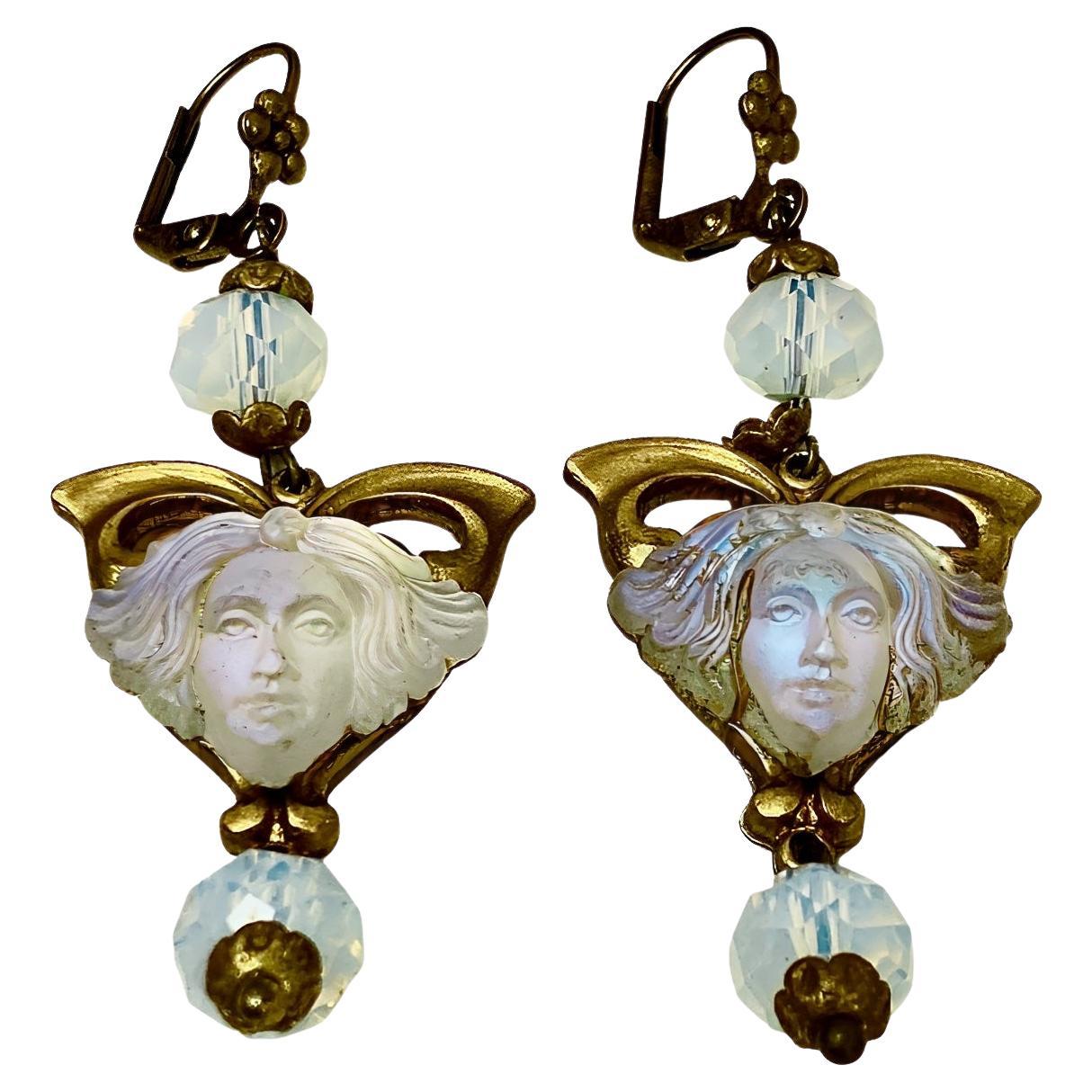 Gilt metal drop earrings, featuring beautiful detailed opaline glass lady heads with faces, and opaline faceted glass beads. Measuring length 6 cm / 2.36 inches including the flower lever back hooks.

This is a pair of stunning and unusual opaline