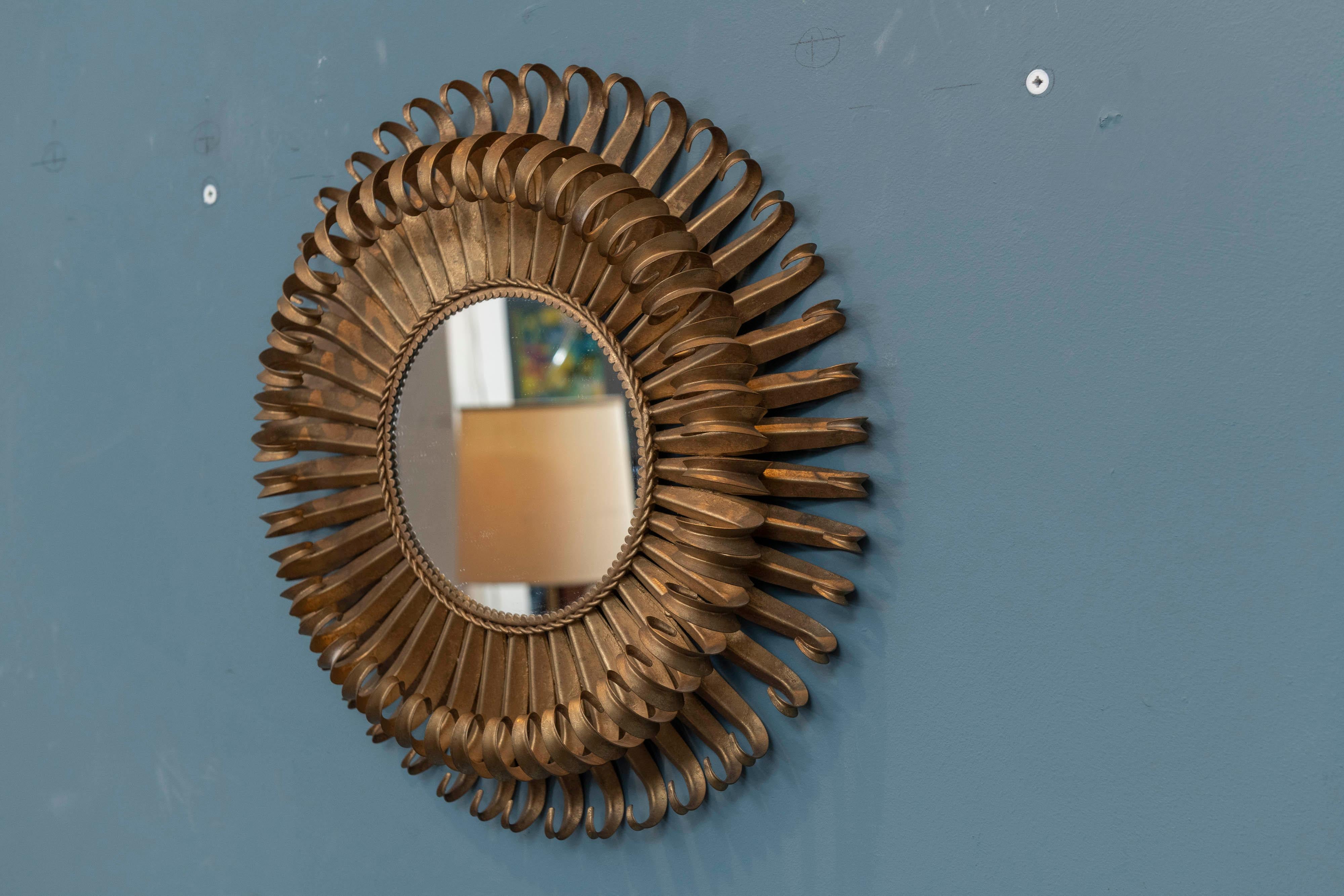 Hollywood Regency gilt-metal eyelash wall mirror, great condition and ready to install.