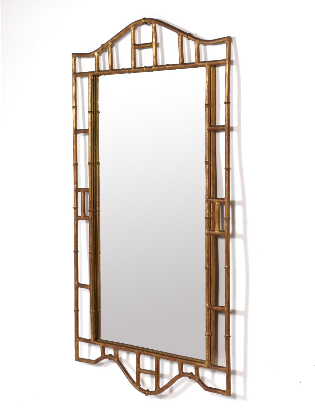 Glamorous Gilt Metal Faux Bamboo Mirror, Italy, circa 1960s. Retains its warm original patina. It measures 46