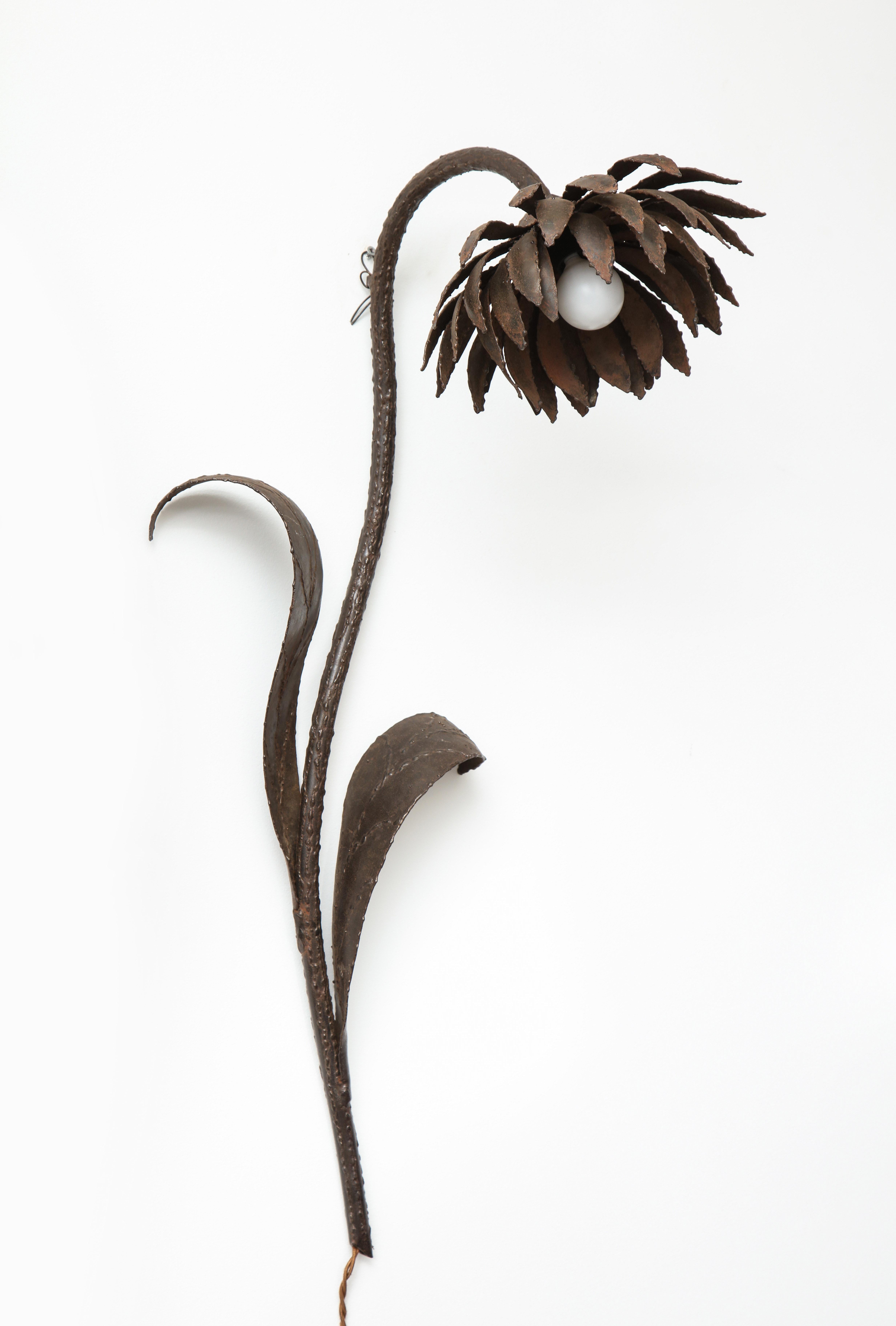 Lovely electrified wall sconce in the form of a flower with stem and leaves