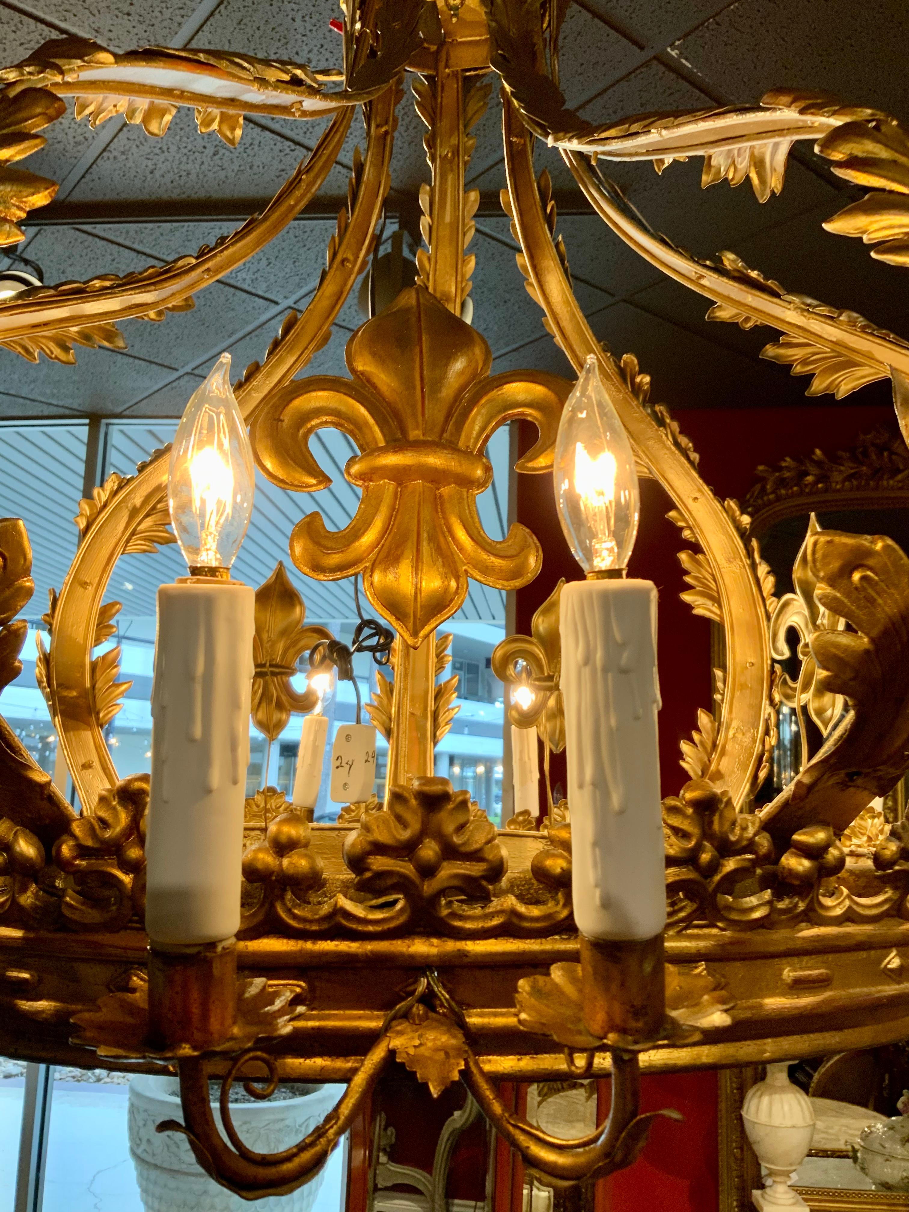 Gilt Metal French  Crown Chandelier with 12 Lights and Fleur D Lis Design In Good Condition In Houston, TX