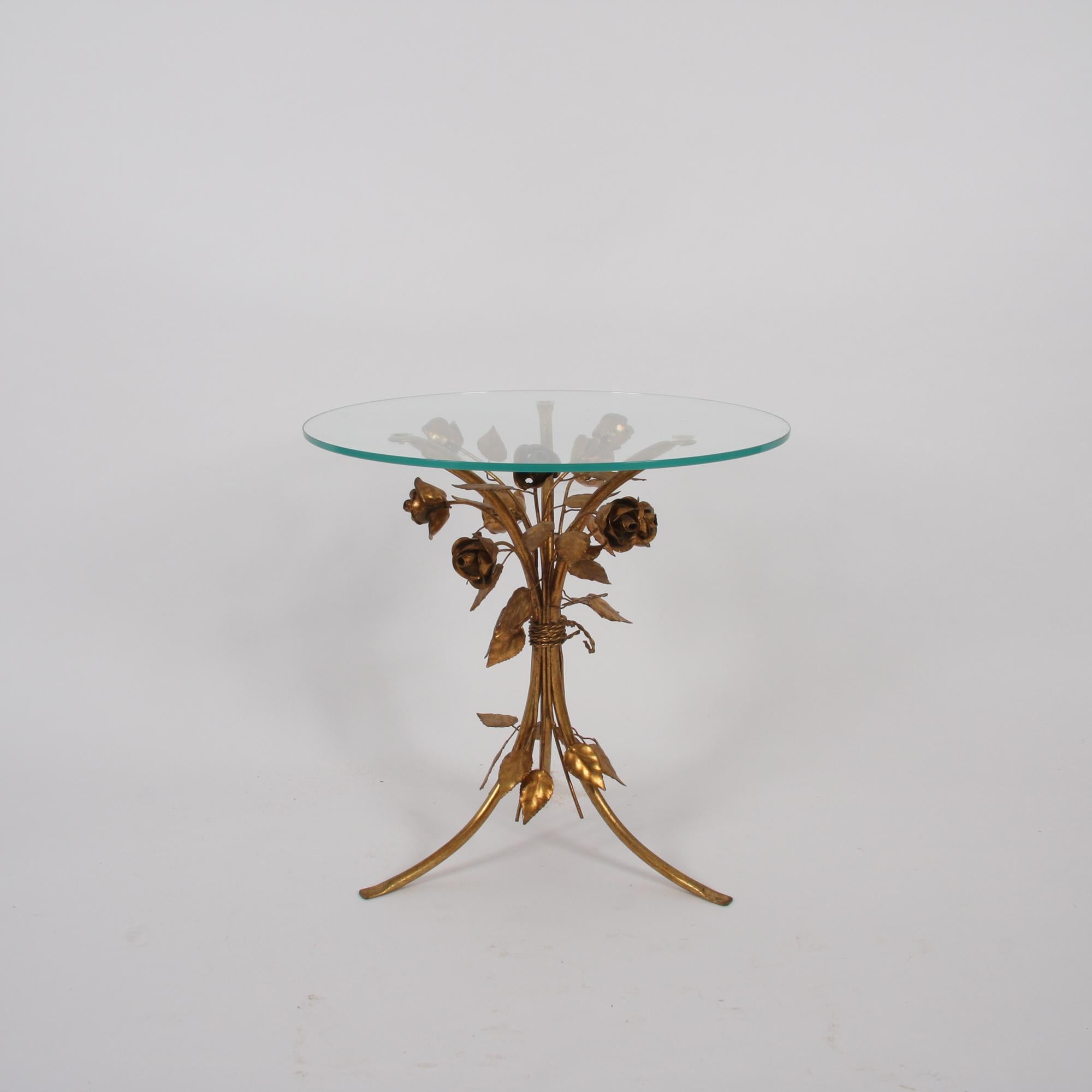 This beautiful Hans Kögl side table, where a bouquet of gold-plated flowers and leaves supports a circular glass top, dates back to Germany, circa 1970.