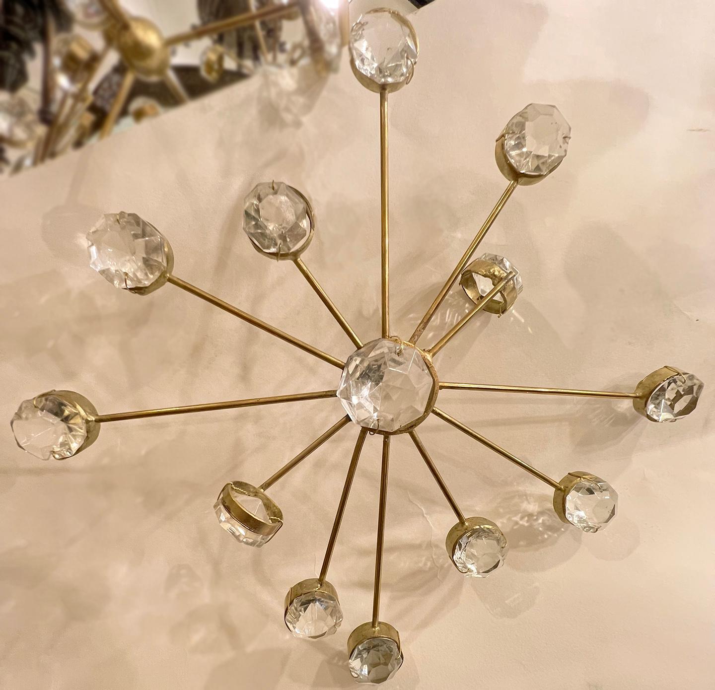 A circa 1960's French gilt metal sputnik chandelier fixture with six chandelier lights.

Measurements:
Diameter: 32