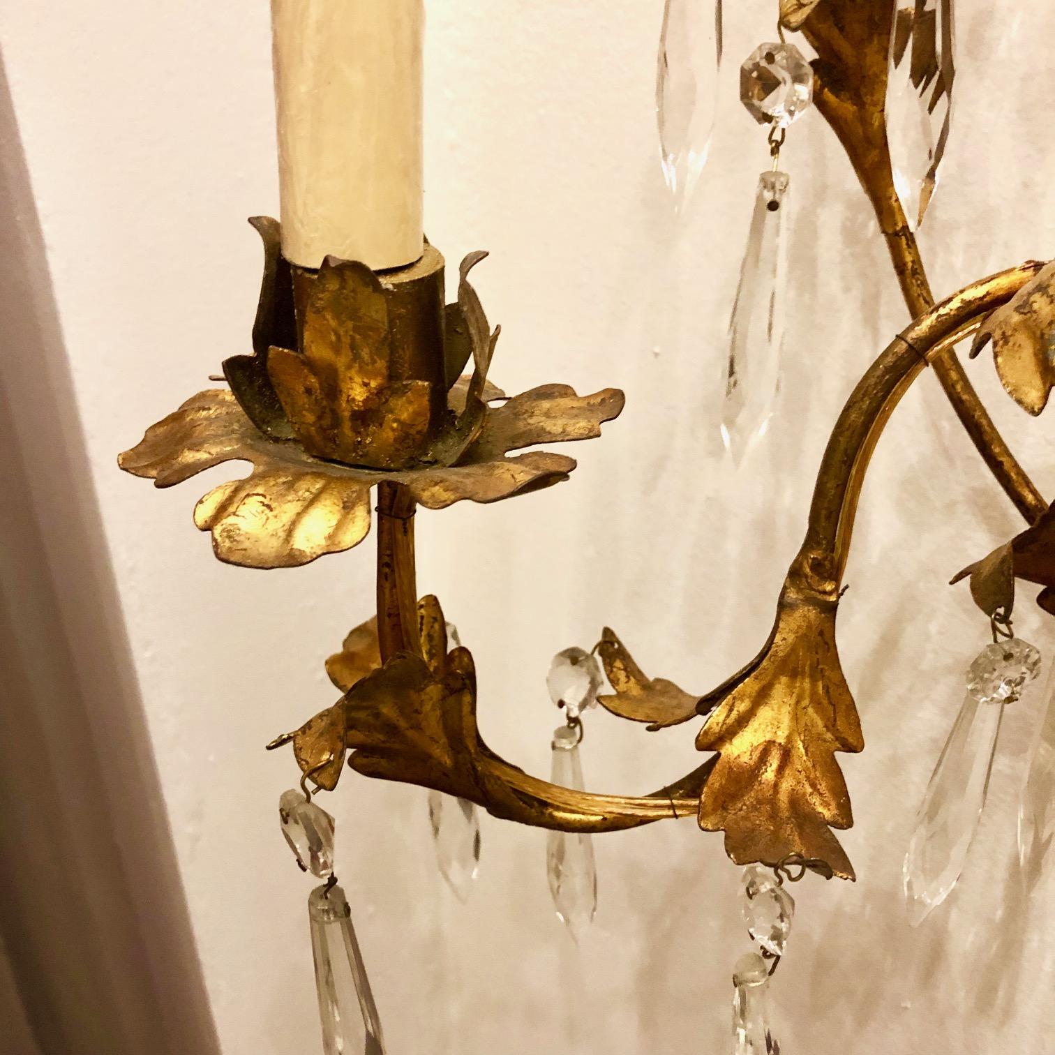 Pair of circa 1930s Italian foliage motif gilt metal sconces with crystal hangings.

Measurements:
Height 18.5