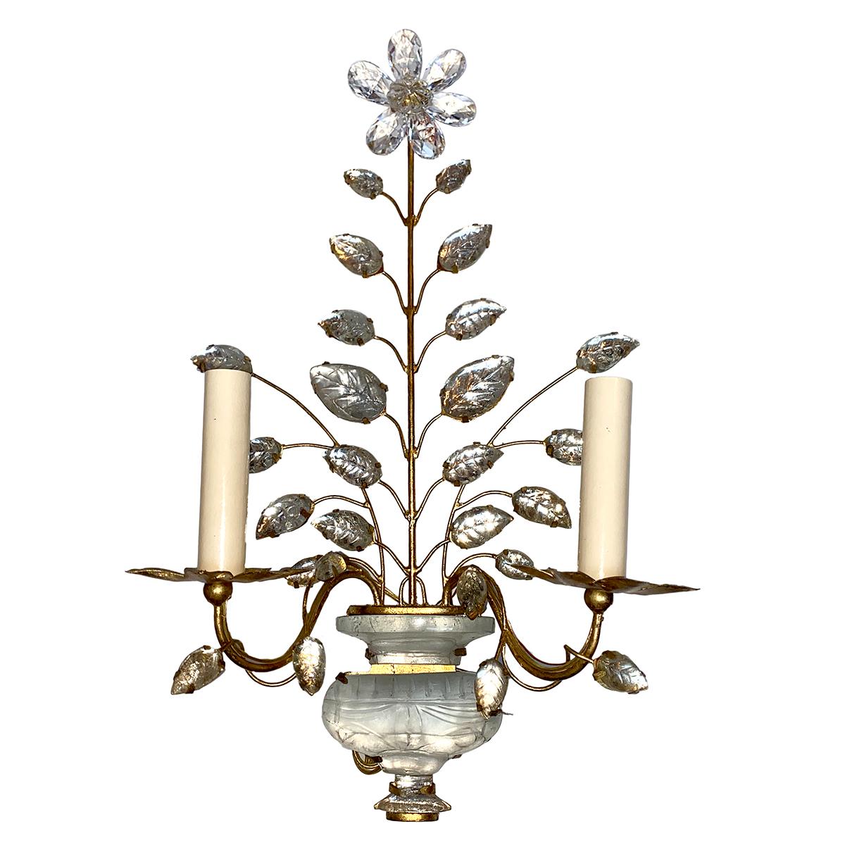 Pair of circa 1940’s French gilt metal sconces with crystal body, flowers and leaves.

Measurements:
Height: 19