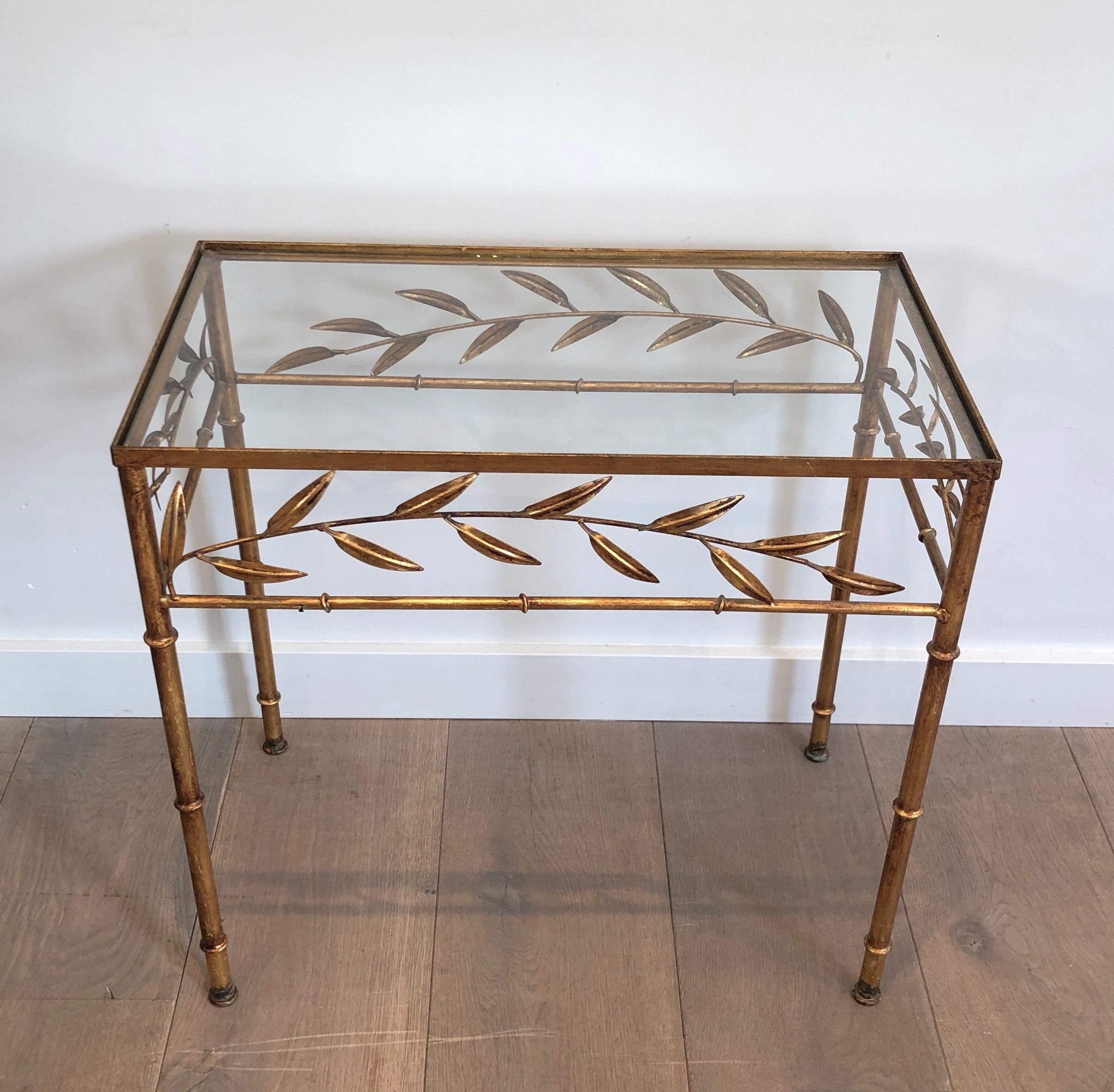 This very nice and decorative small rectangular table is made of gilt leaves. This is a French work, in the style of Coco Channel, circa 1970.