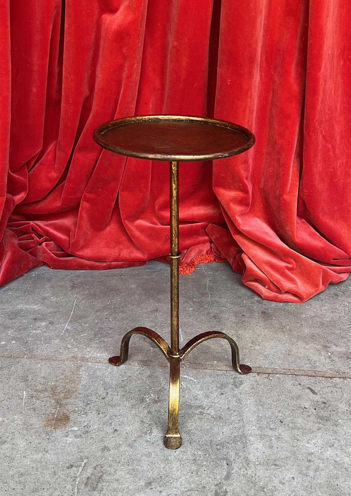 This small Spanish gilt iron martini table combines both form and function, designed to elevate your living space. Based on a 1950s vintage design, it was recently created by skilled artisans using traditional iron-working methods. It features a