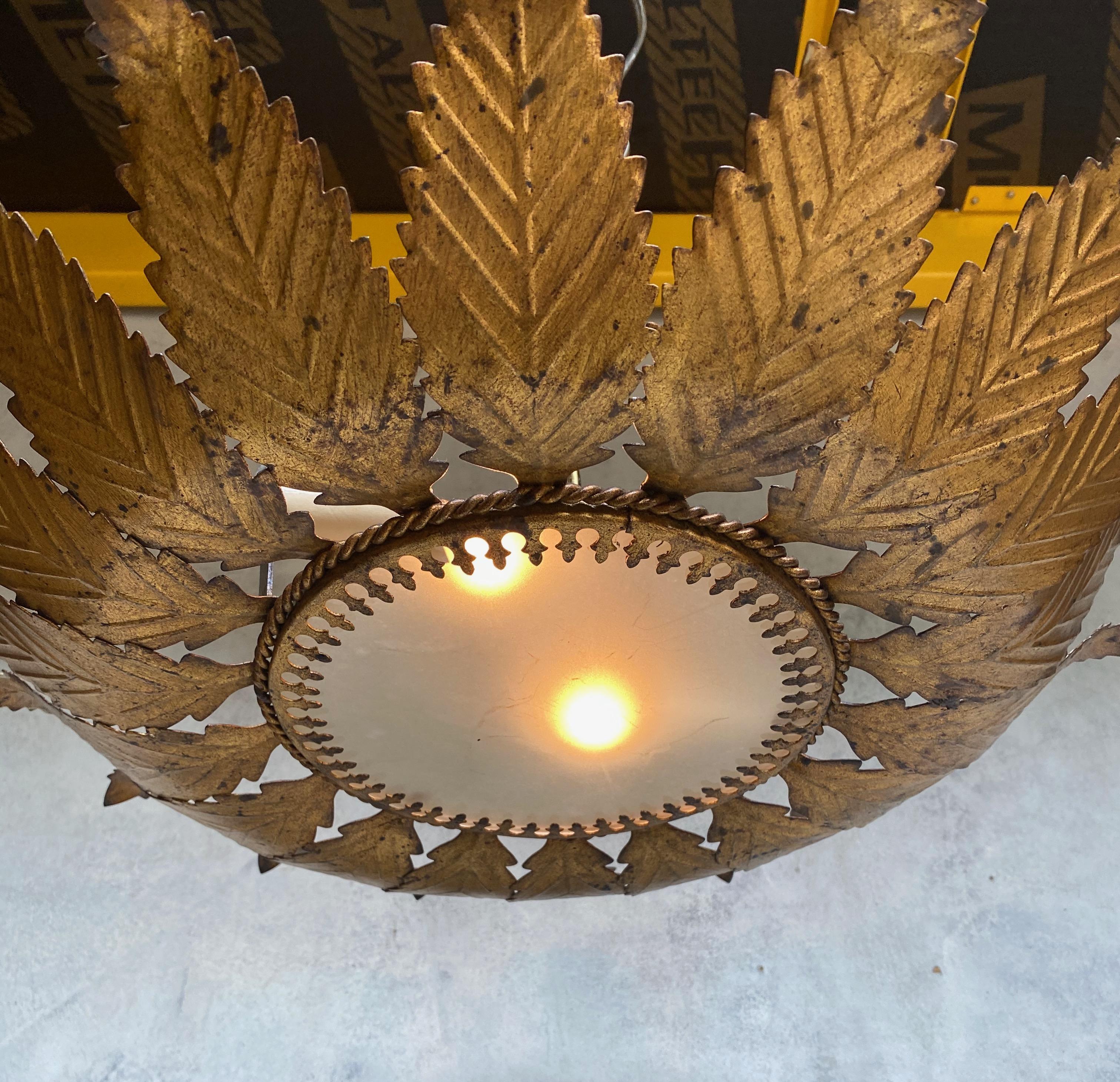 Gilt Metal Sunburst Ceiling Fixture with Feathered Rays For Sale 1