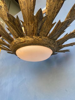 Gilt Metal Sunburst Flush Mount Ceiling Fixture With Convex Globe