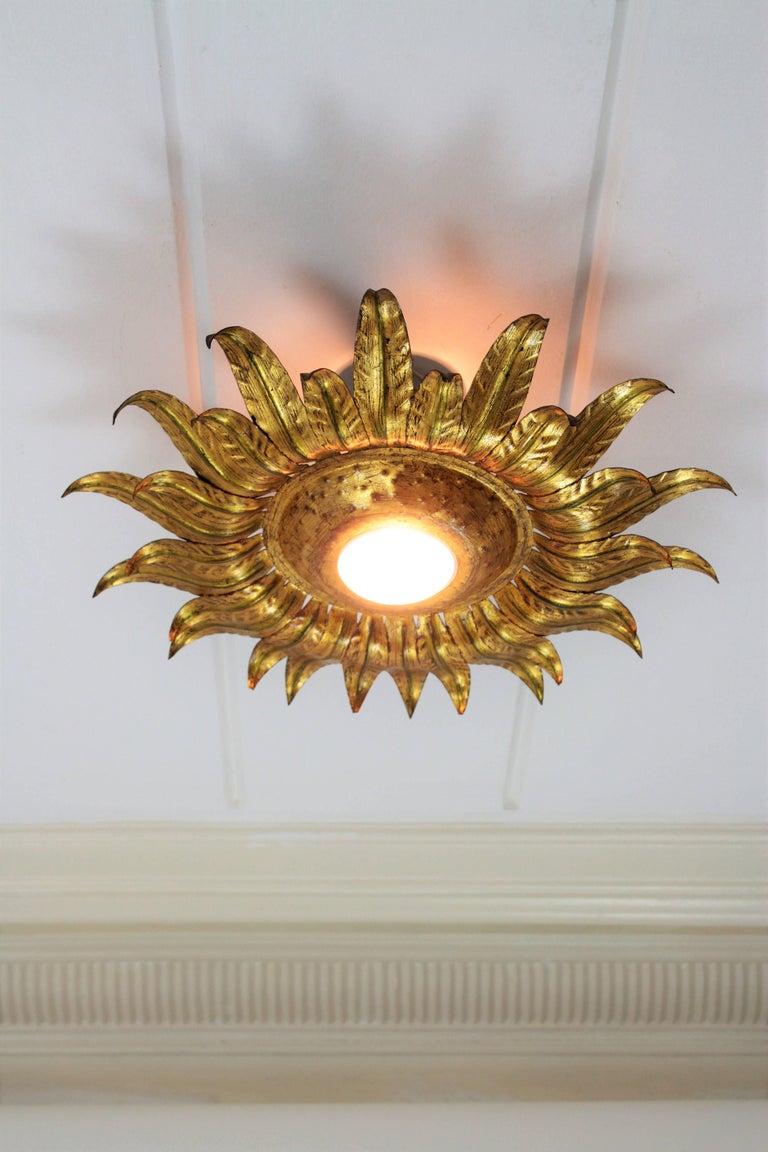 Gilt Metal Sunburst Light Fixture with Leaf Details and Green Accents