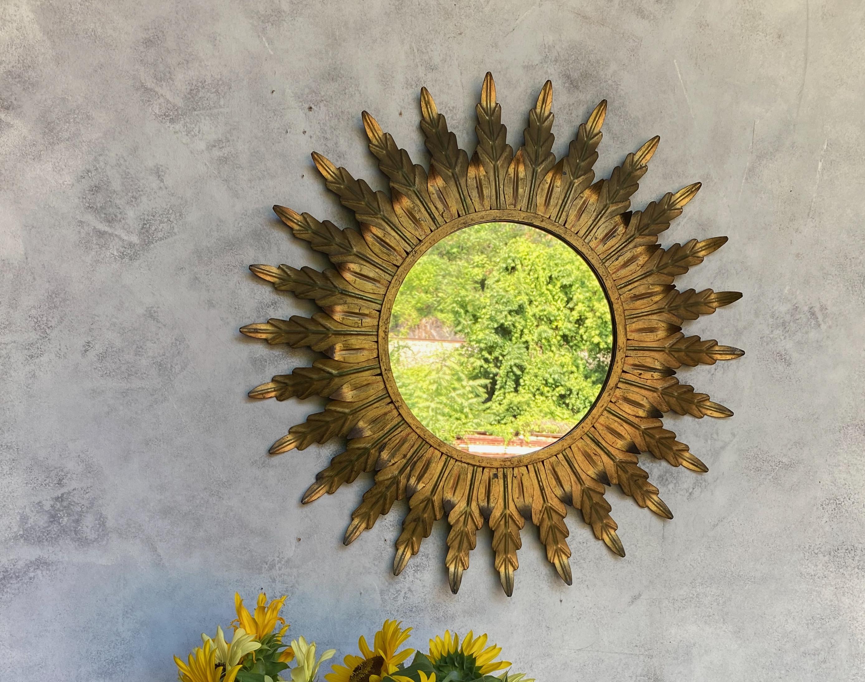 Art Nouveau Gilt Metal Sunburst Mirror with Radiating Leaves and Traces of Green Hues
