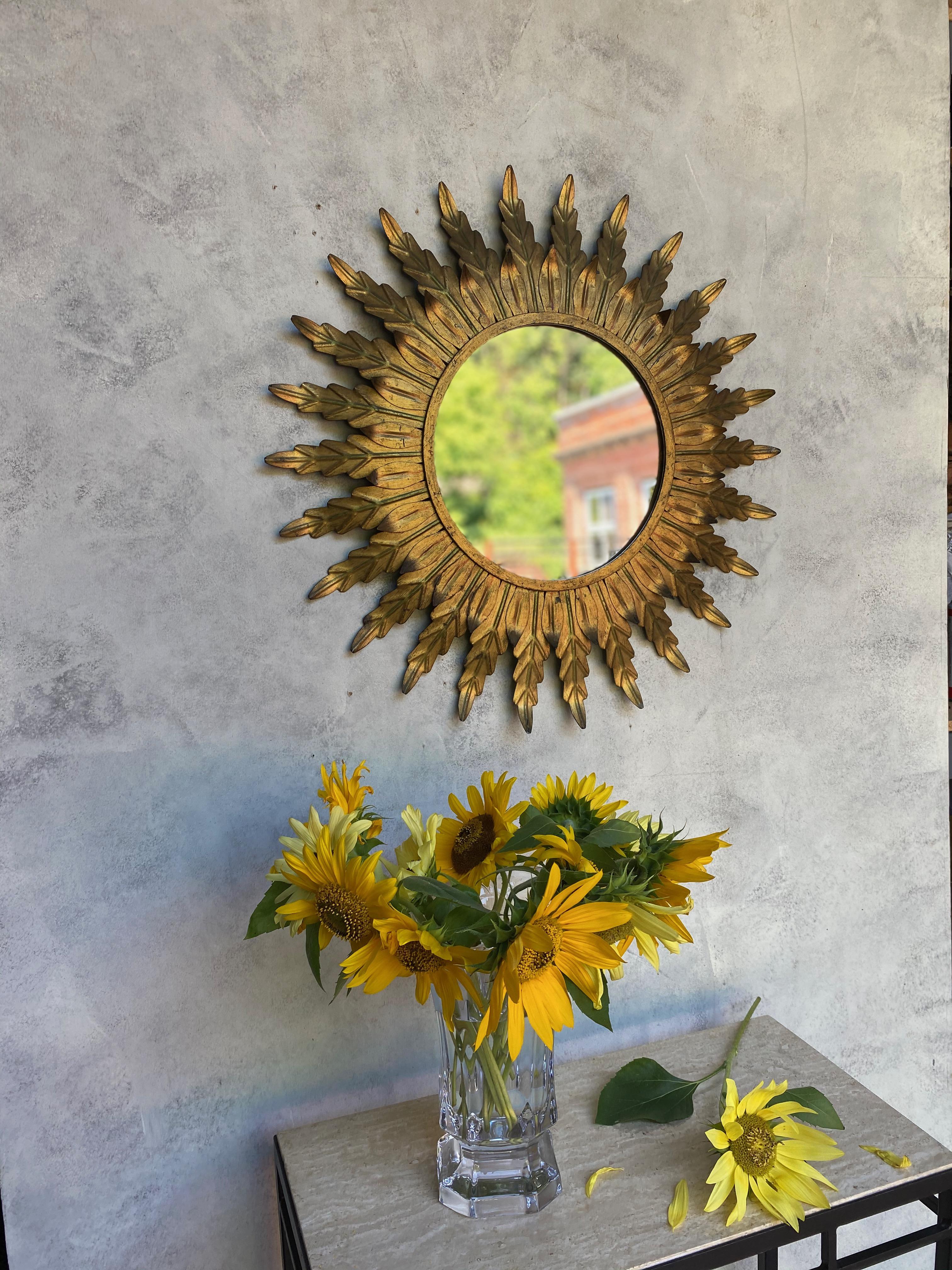 Gilt Metal Sunburst Mirror with Radiating Leaves and Traces of Green Hues 1