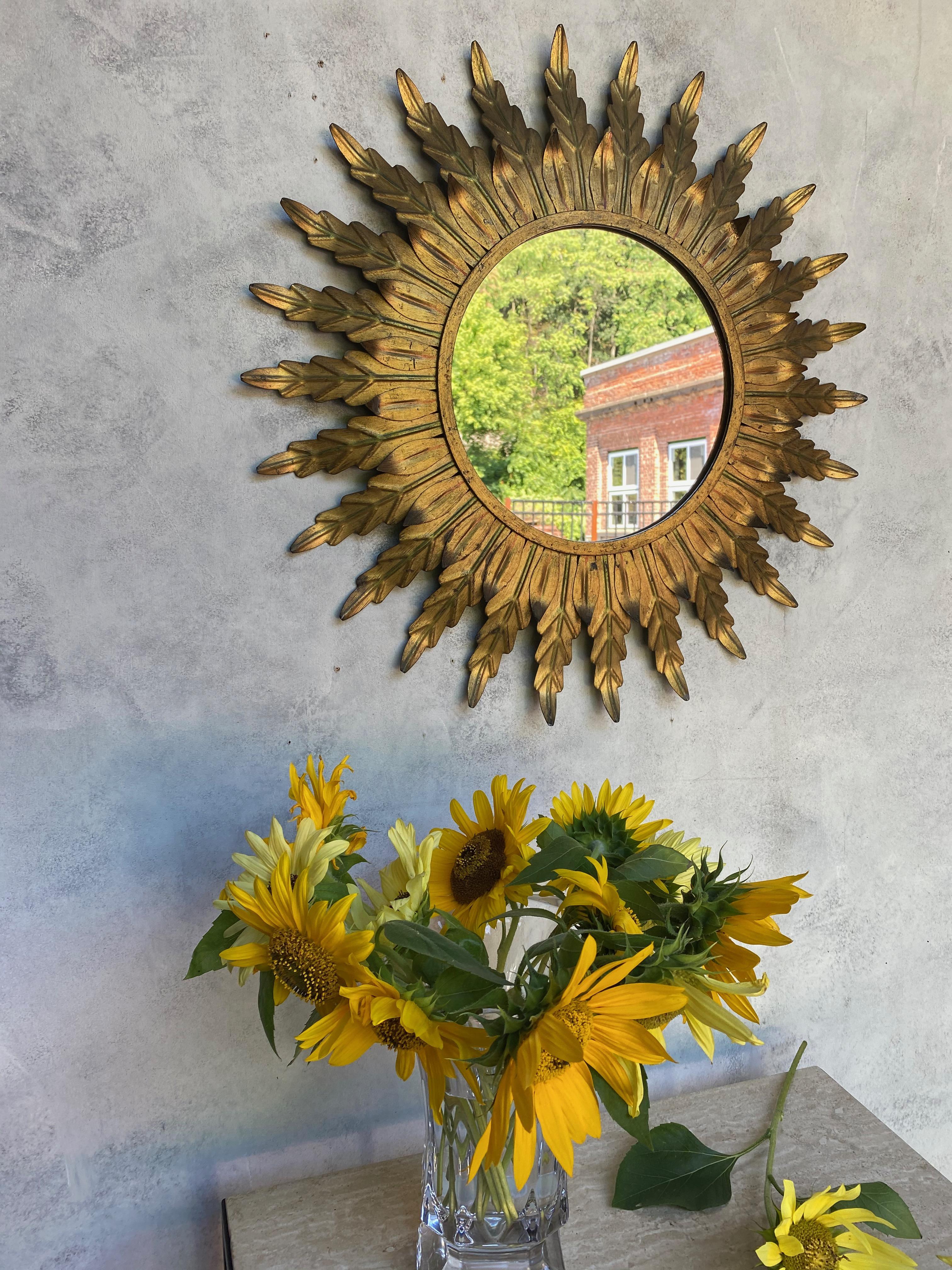 Gilt Metal Sunburst Mirror with Radiating Leaves and Traces of Green Hues 3