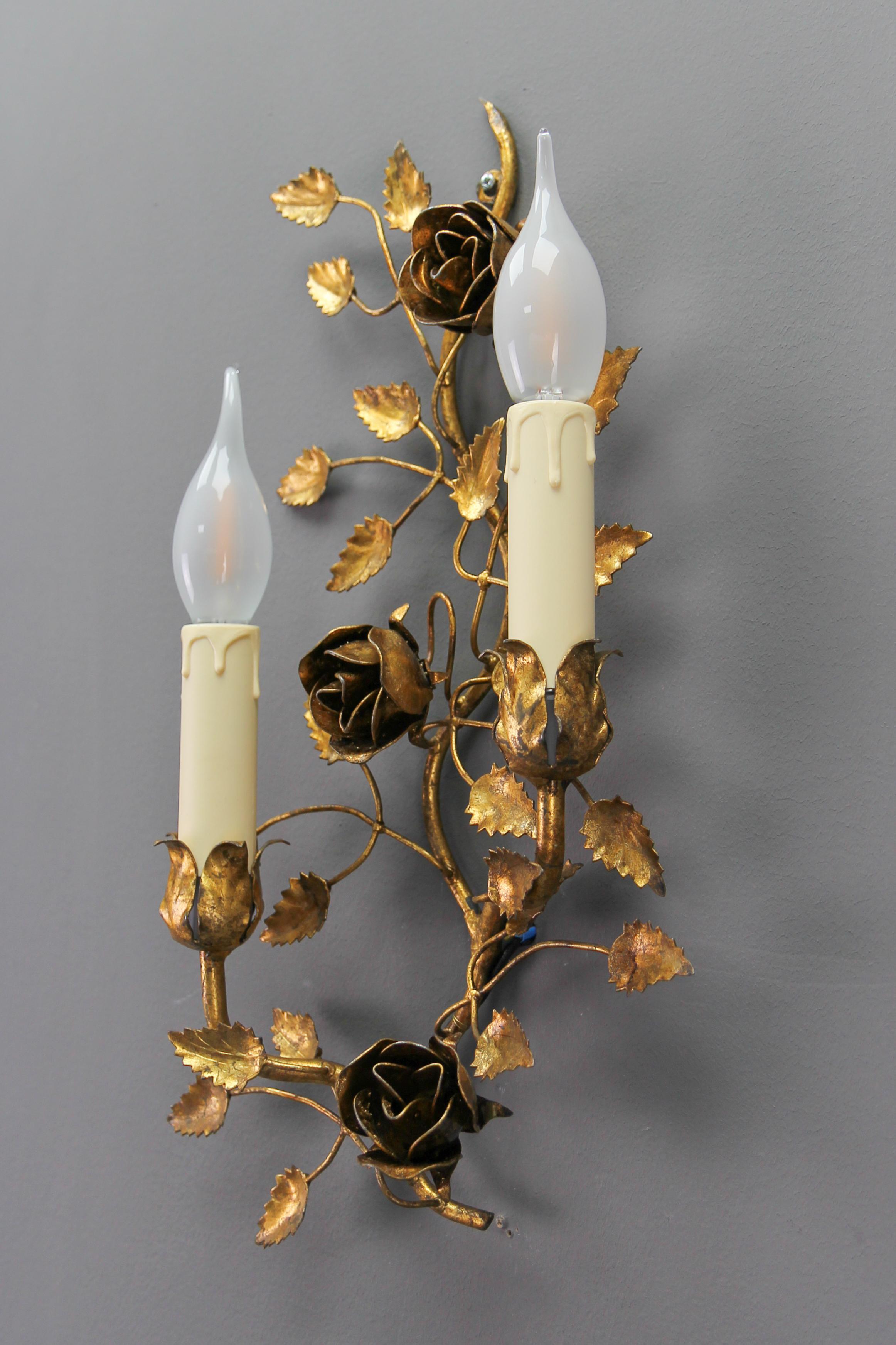Gilt Metal Two-Light Wall Sconce with Roses and Leaf, Italy, the 1970s.
This adorable Hollywood Regency-style gilt metal wall sconce features a floral design - two arms in the shape of roses with leaves.
Two new sockets for E14 size light bulbs,