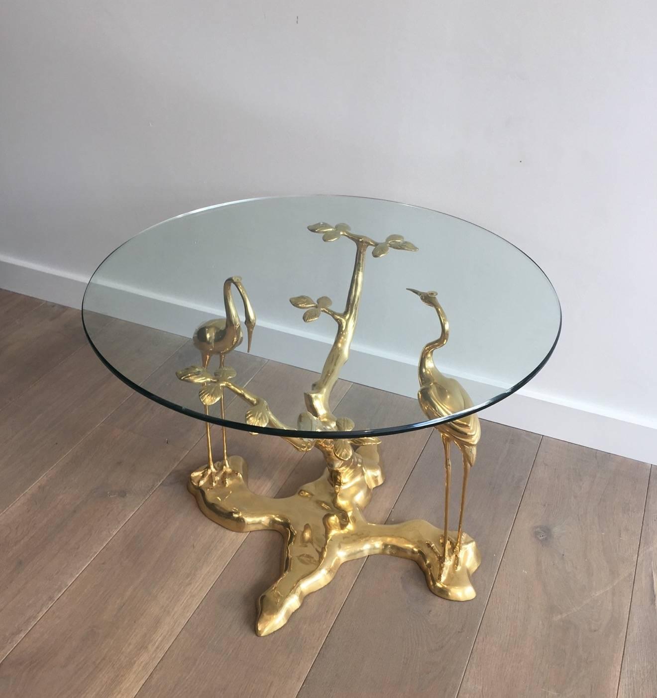 Rare Mid-Century Modern gilt bronze coffee table by Belgian designer Willy Daro representing a pair of herons standing next to a tree, French, 1970s.
 
This table is currently in France, please allow 4 to 6 weeks delivery to our warehouse in Long