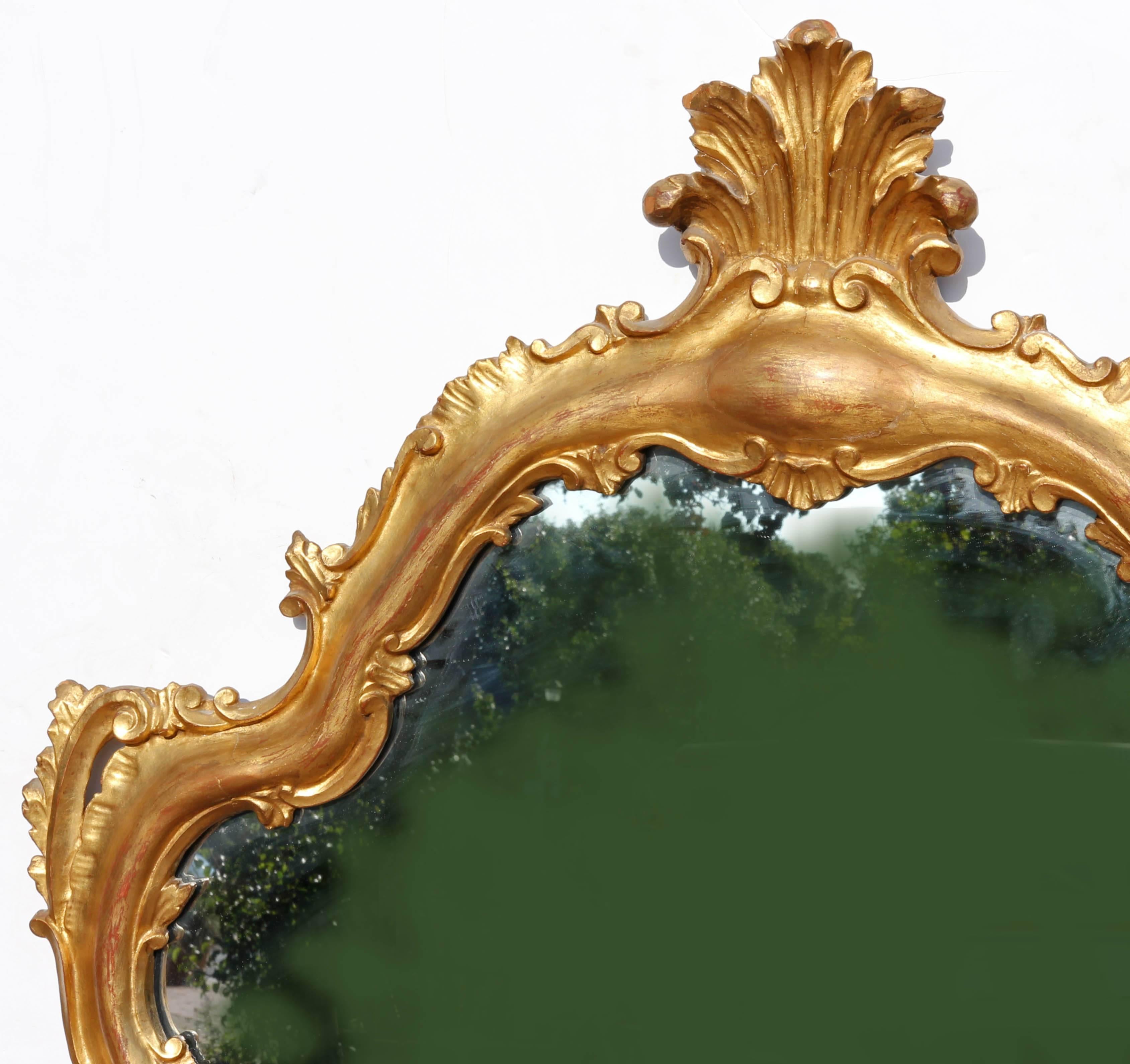 Large vintage Italian gold leaf carved wood mirror. Rococo style. Measure: 58