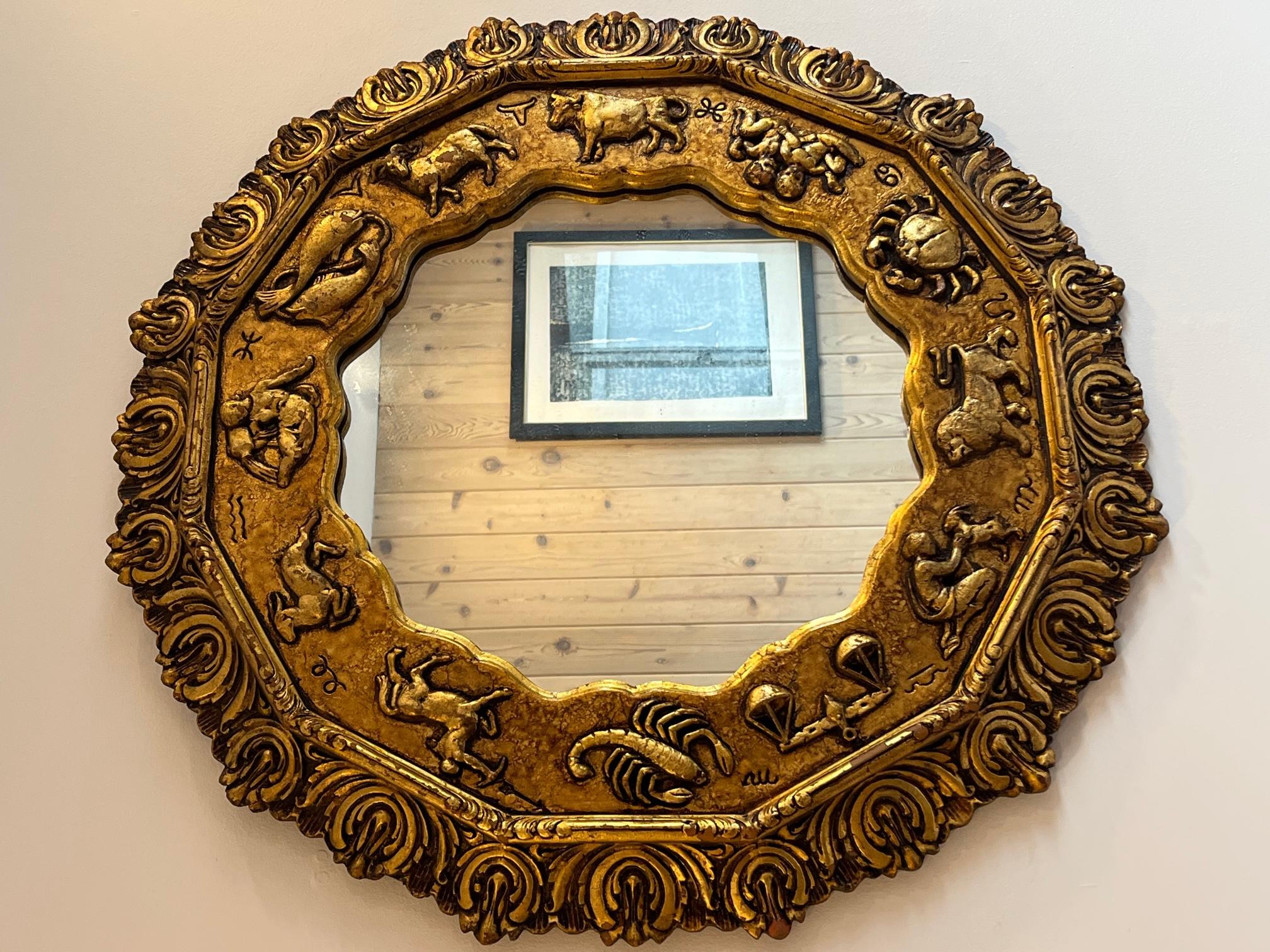 A French circa 1920s gilt mirror with zodiac signs.

Measurements:
Diameter: 33