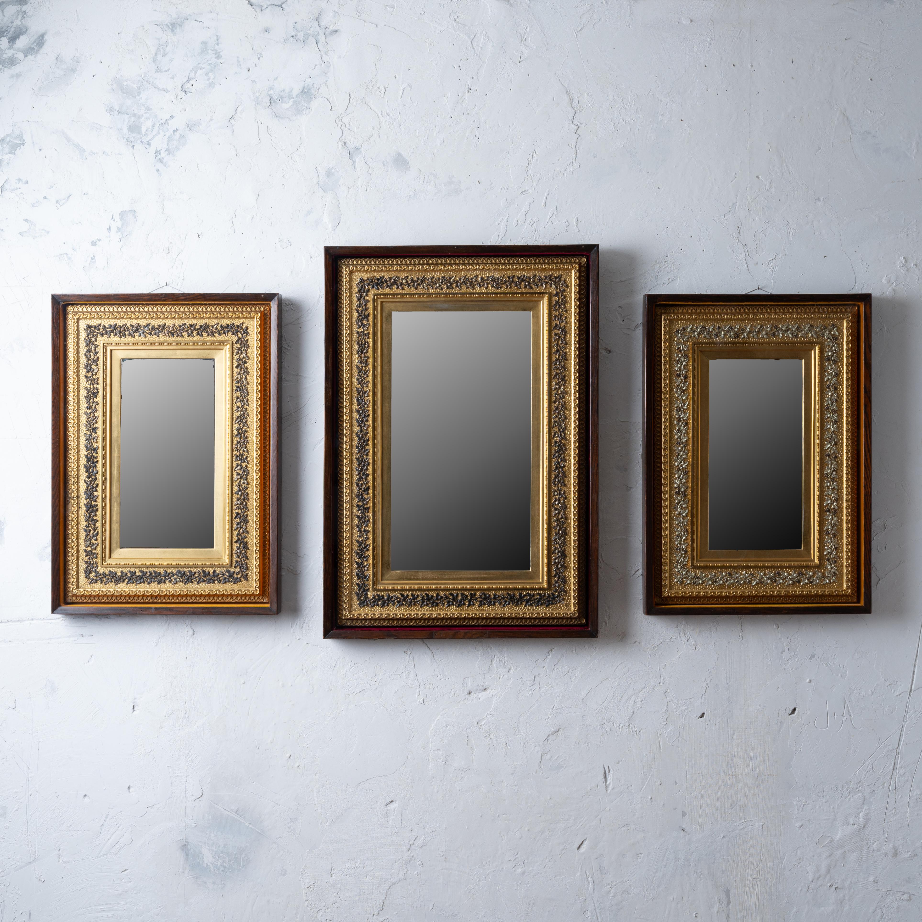 A set of three gilt framed mirrors in custom shadowbox frames, circa 1880s.  
Maker’s label remains on rear of one mirror:  A.H. Fowle’s Art Parlor of Grand Rapids.

23 ½ inches wide by 33 ½ inches tall by 2 ¼ inches deep 
19 ¼ inches wide by 27 ¼