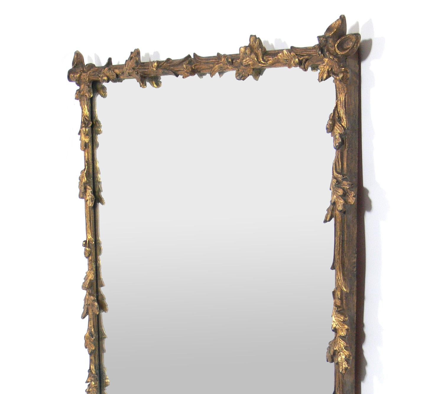 Gilt oak leaf branches mirror, American, circa 1940s. Wonderful patina to both gilt frame and original mirrored glass. It measures an impressive 56.5