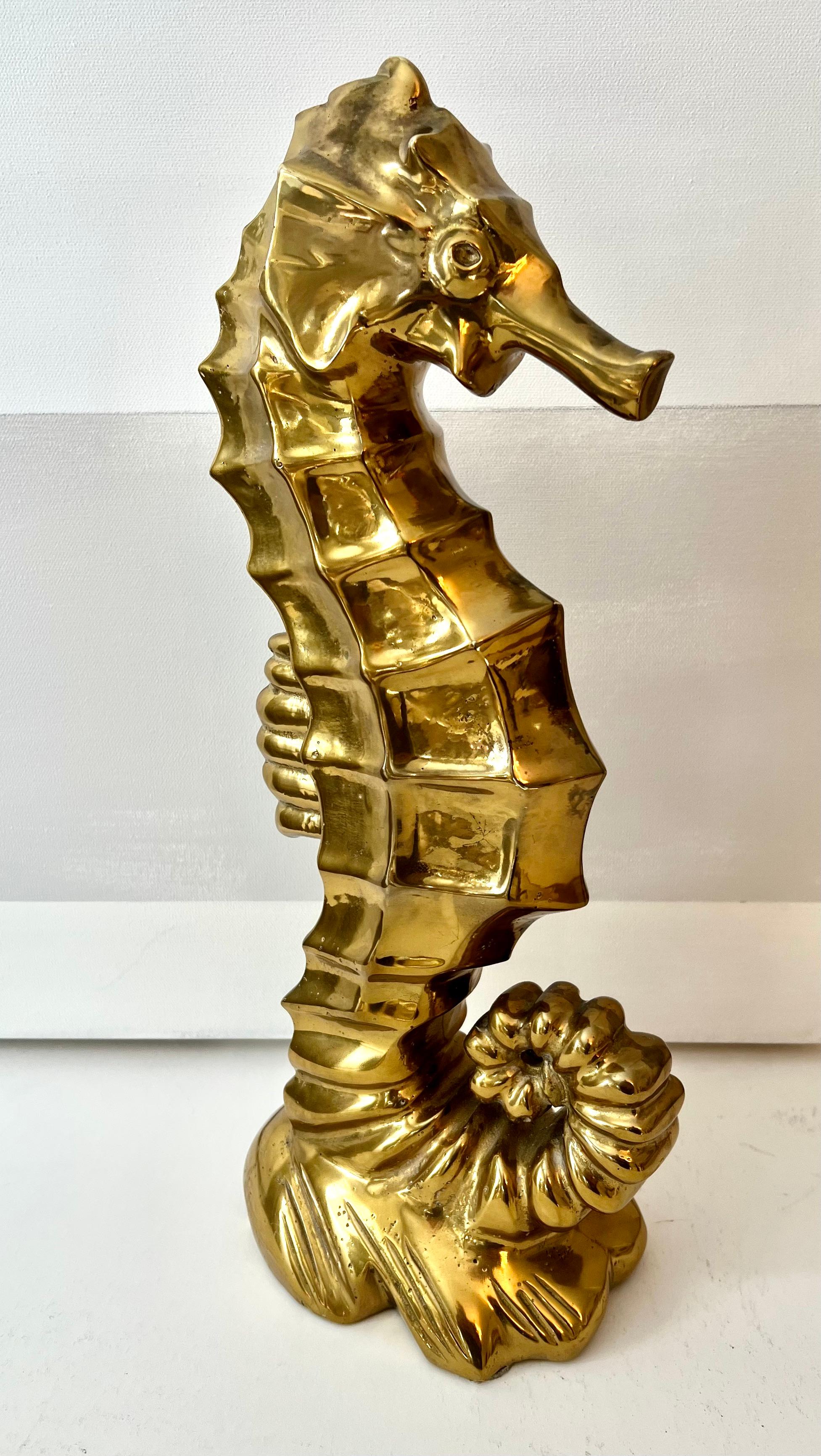  Decorative Sculpture of a seahorse - Gold over bronze.  A stunning piece for the centerpiece of a table or room, or an addition to a seaside story in the garden or living space.  The piece, at 18.5 pounds, the sculpture is a substantial