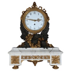Horloge en bronze doré et patiné avec aigle