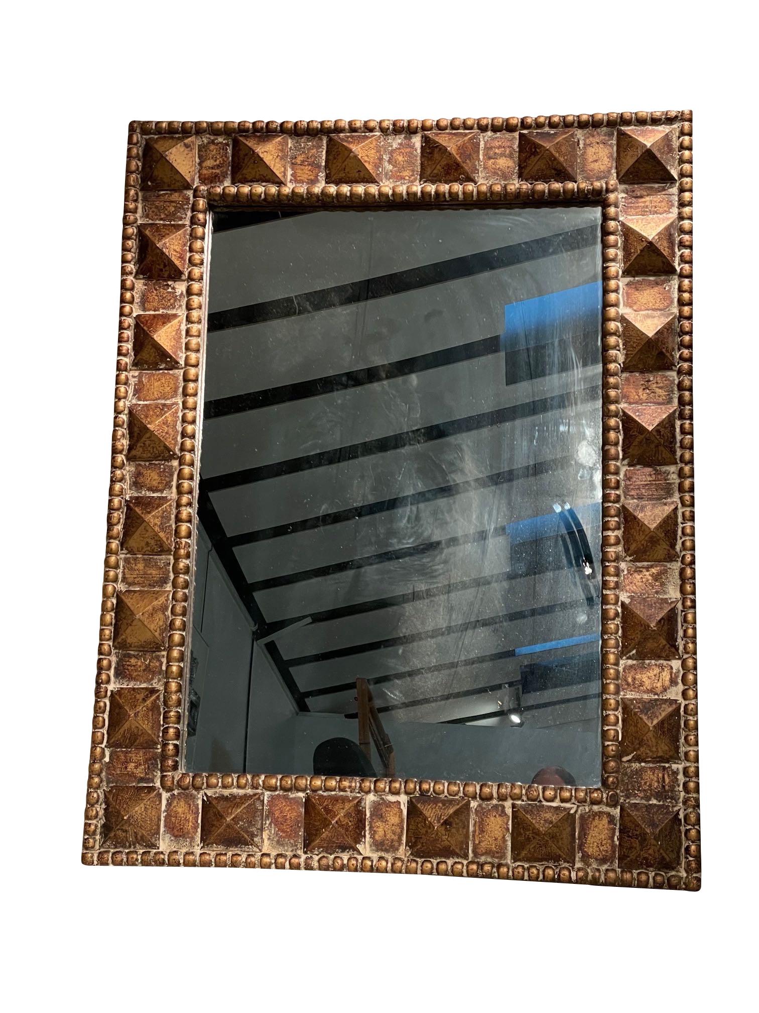 1940's French gilt wood frame mirror with decorative raised pyramid design.
Beaded border design.
Beautiful natural patina.
Original mirror.
