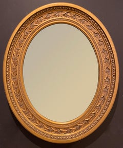 Miroir ovale doré de style Régence