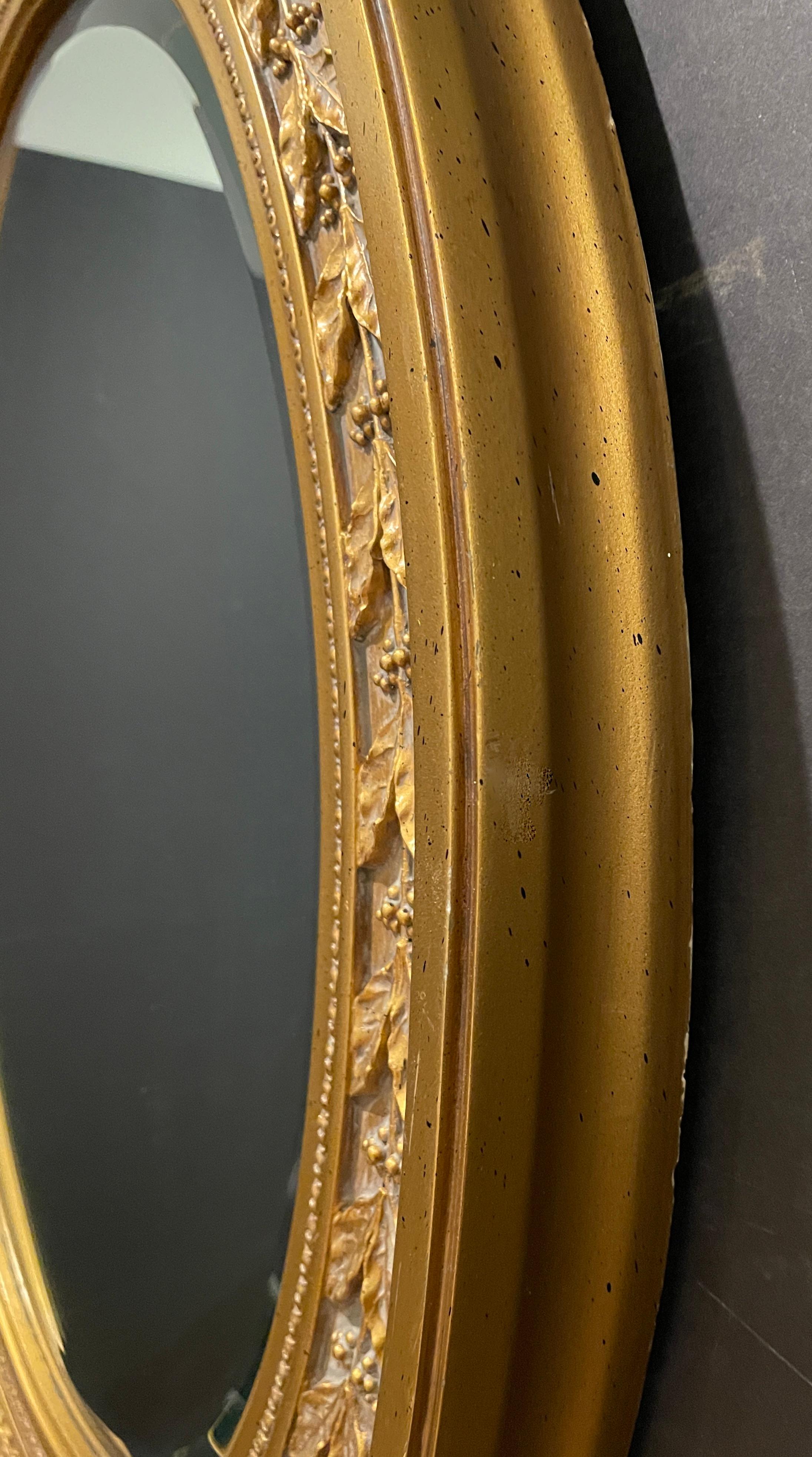 20th Century Gilt Regency Style Oval Mirror For Sale