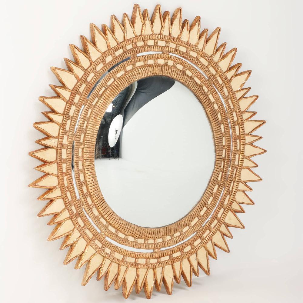 Channel your inner sun god and adorn your wall with this statement piece, a starburst mirror with gold gilt glass in the sunburst / 