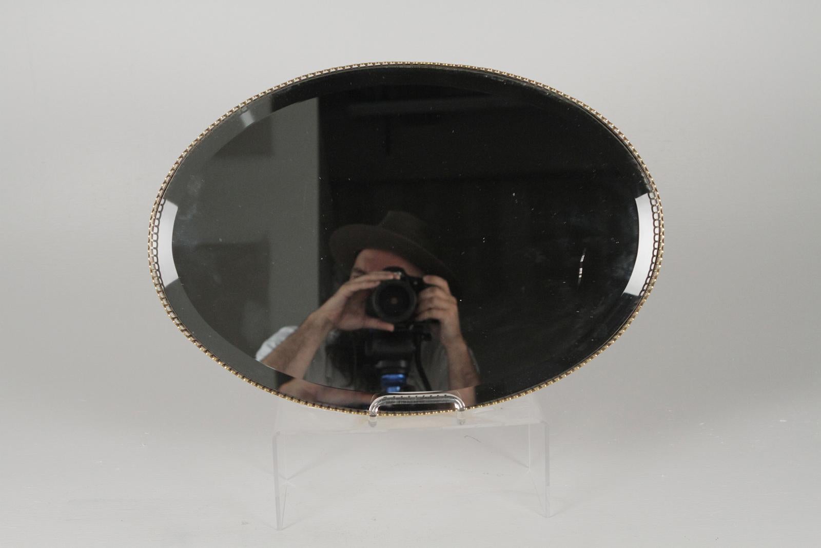 Simple and Classic oval mirrored dresser tray with gilt pierced gallery edge.