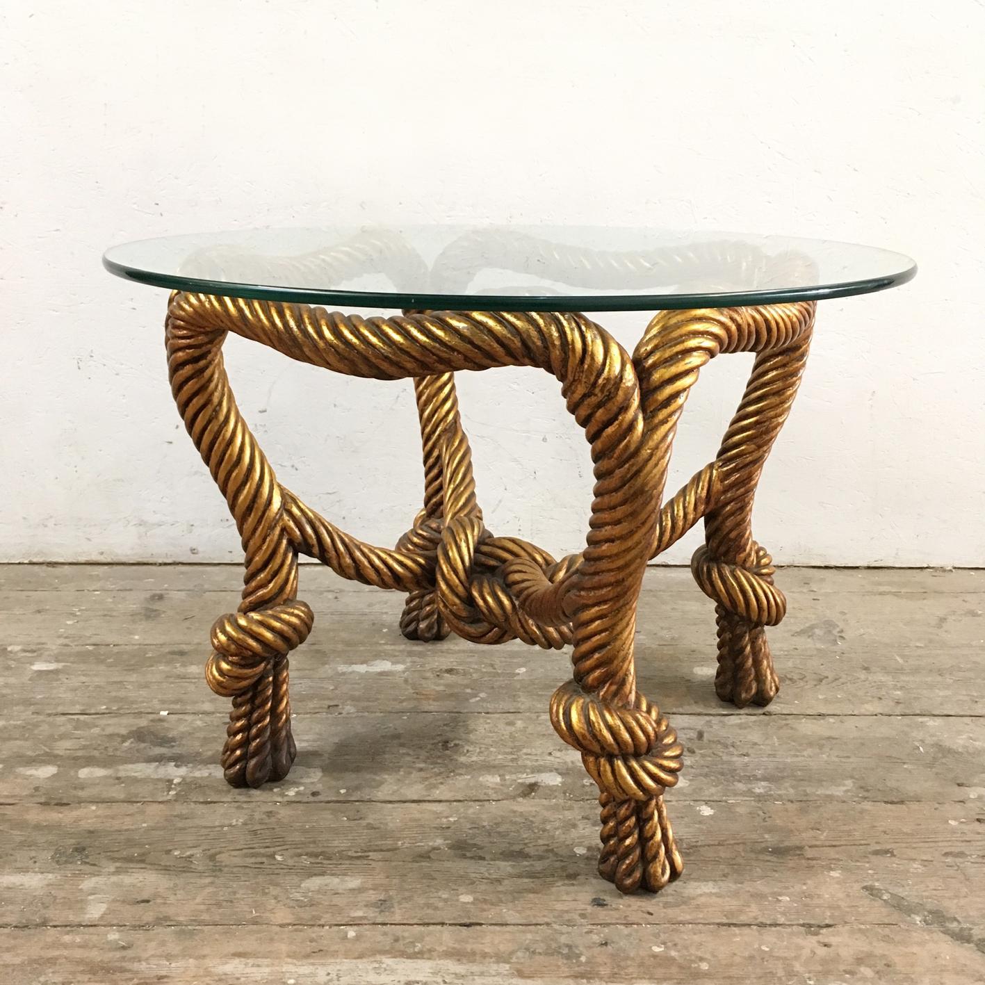 Vintage gilt faux rope design glass table

Beautiful design and very striking statement piece

The table base in the design of rope is in a resin/composite material, with gilt painted finish

The glass plate is toughened glass

Measures:
