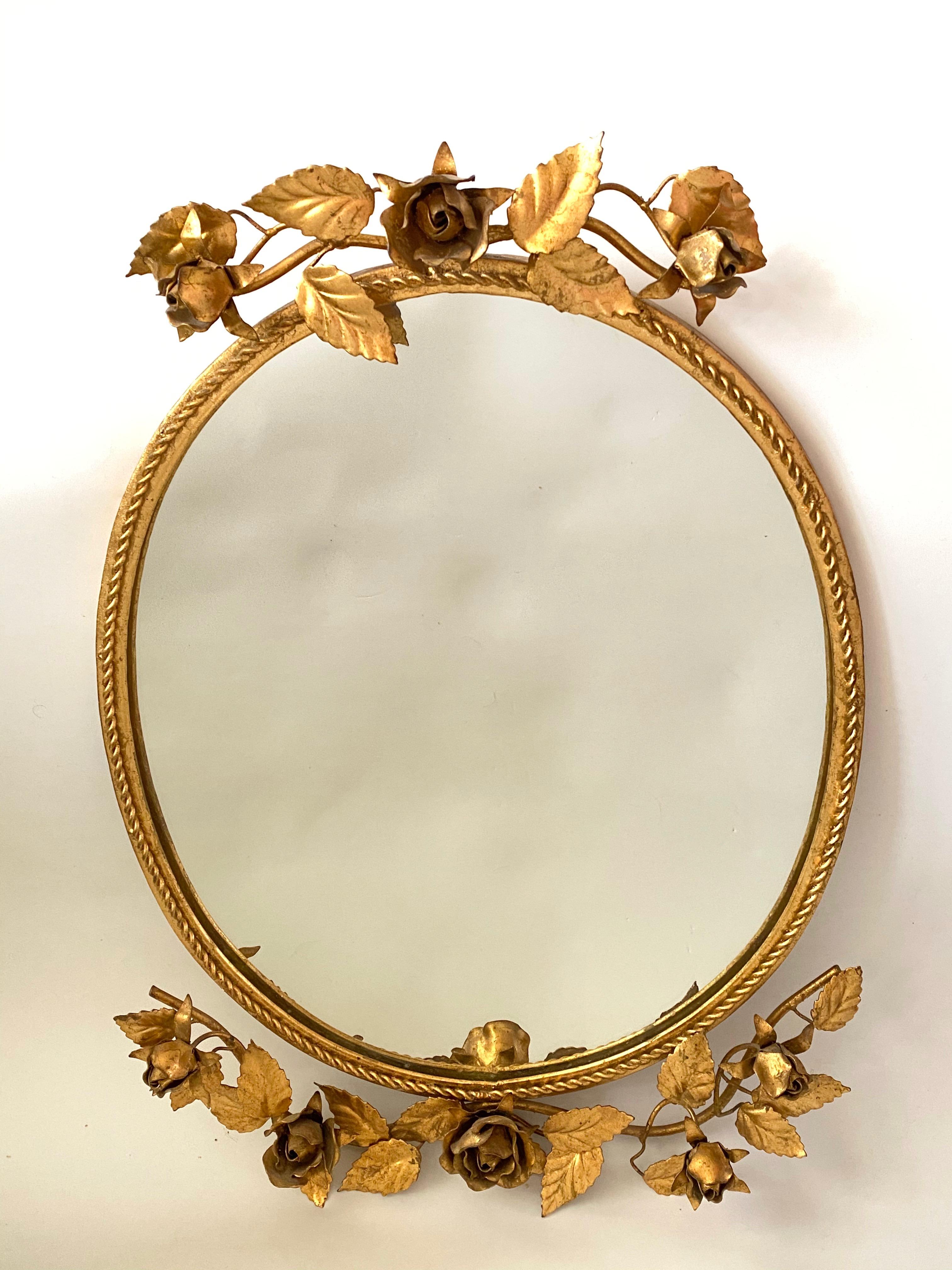 A gorgeous Hollywood Regency mirror. Made of gilded metal. No chips, no cracks, no repairs. It measures approximate 24