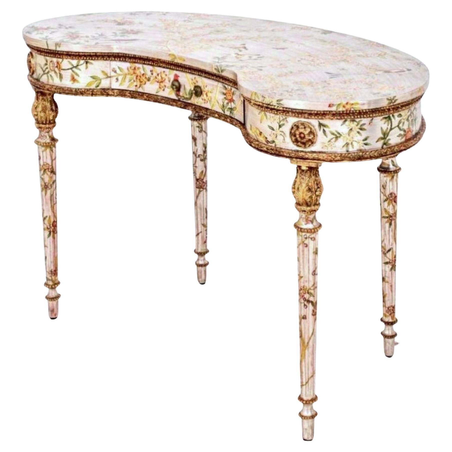 Gilt, Silvered and hand-painted Kidney dressing table, Desk, Louis XVI manner. Gorgeous piece with elegant proportions and masterful application and placement of Chinoiserie birds and floral motif throughout. Gilt accents. Hollywood regency glamour.