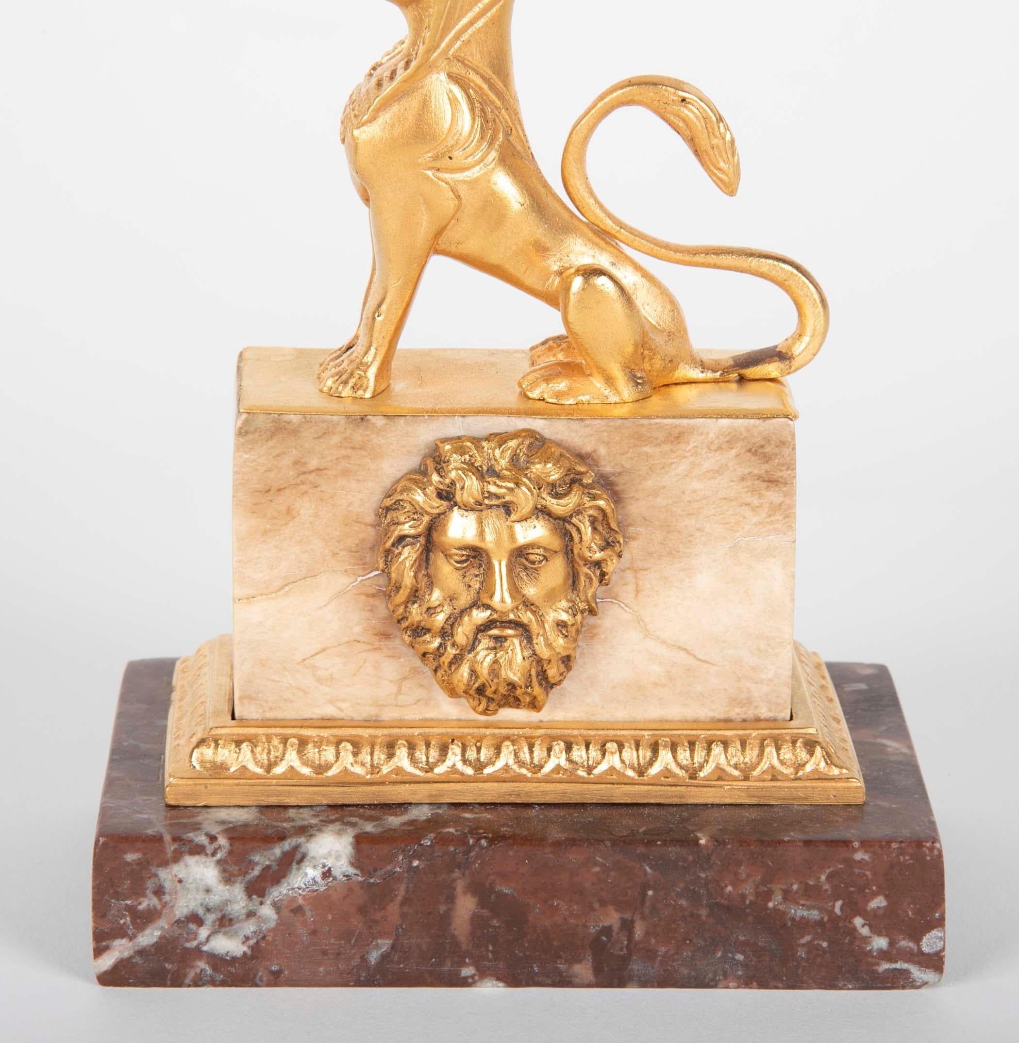 Empire Gilt Sphinx Themed Candlestick on a Stepped Marble Base For Sale