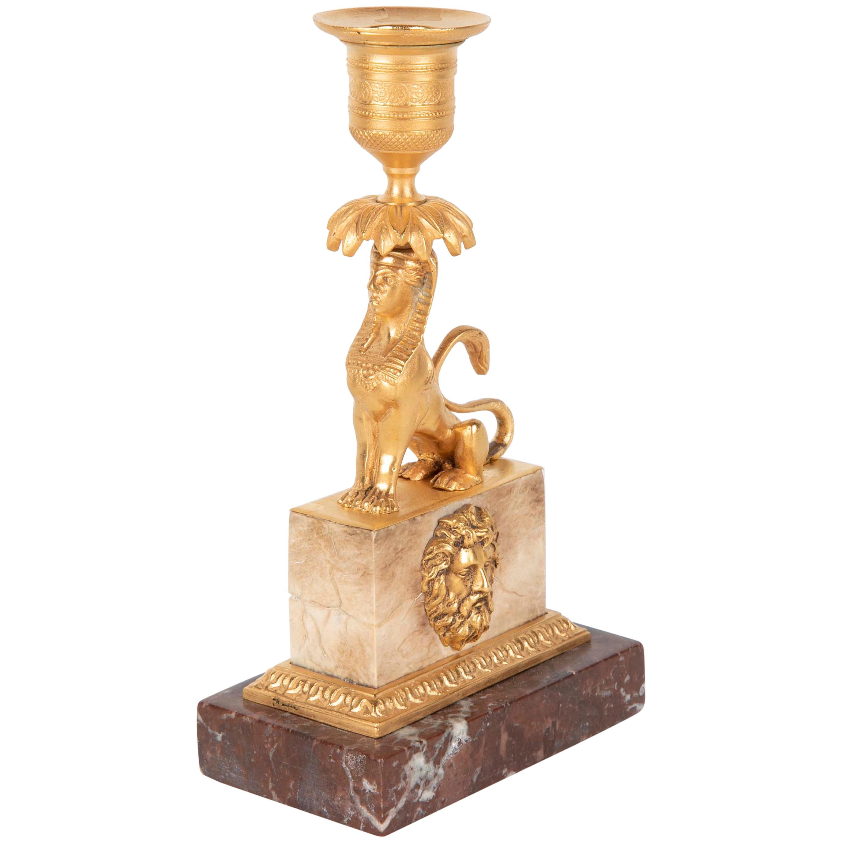 Gilt Sphinx Themed Candlestick on a Stepped Marble Base For Sale