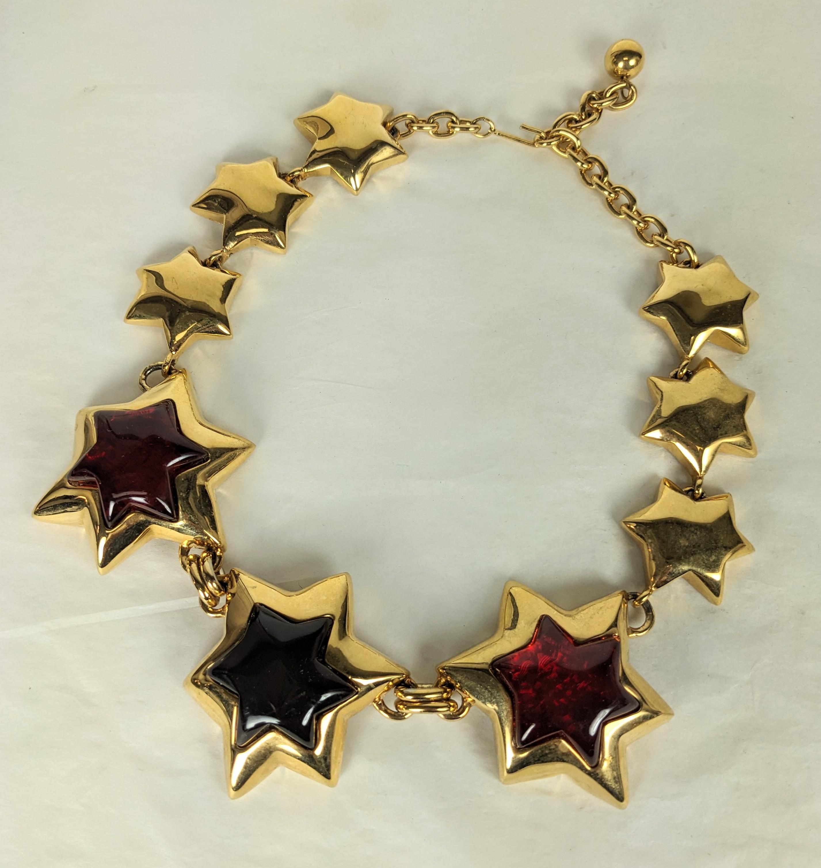 Imposing Gold Toned Star Motif Necklace with resin jelly stones in 2 tones of ruby from the 1990's in the YSL style. Large and striking scale.  Largest star 2.25