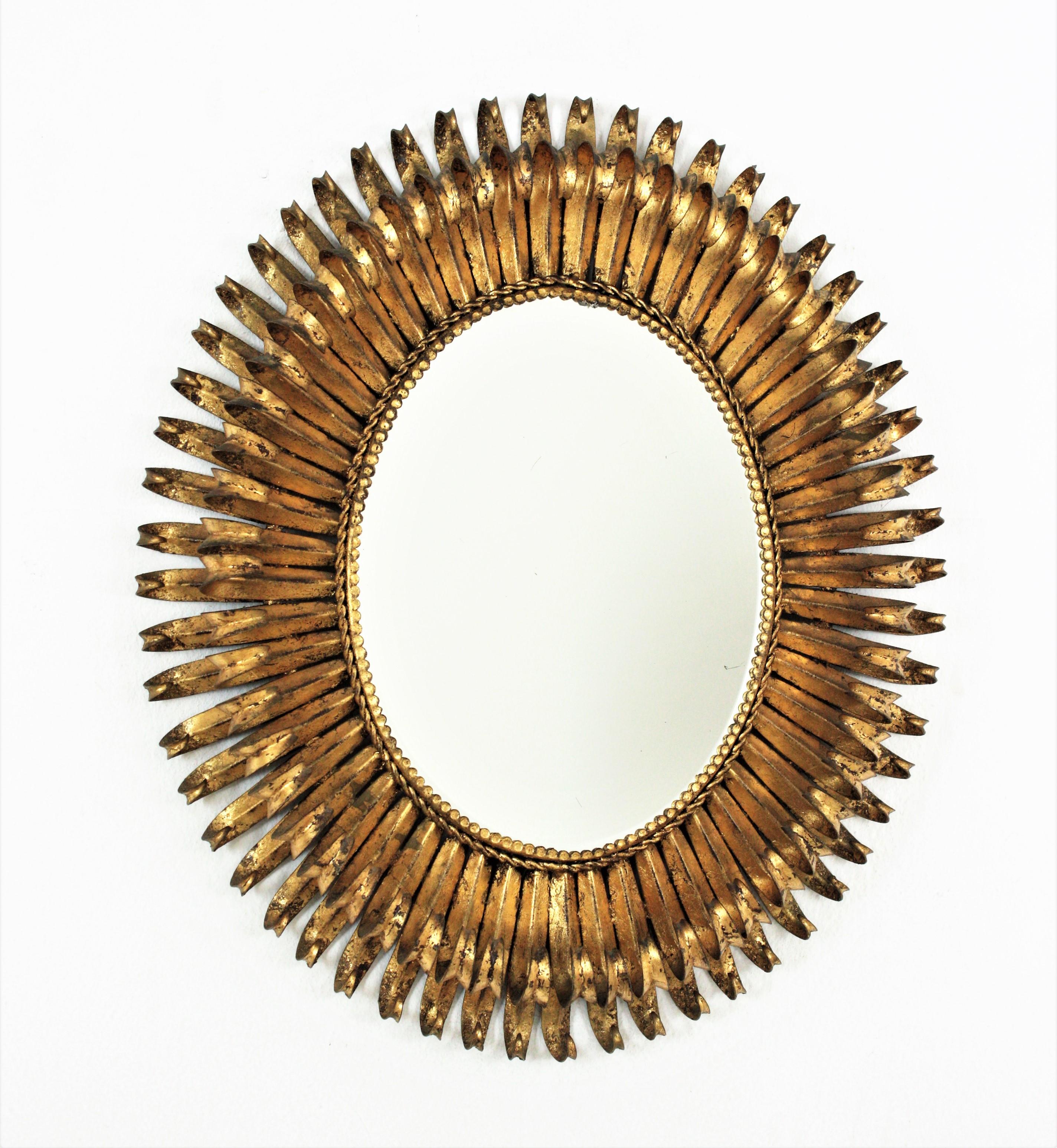 Eye-catching double layered eyelash gilt iron sunburst mirror, France, 1950s
The frame is entirely made by hand with a double layer of hand-forged iron curved beams in eyelash shape.
It will be a nice midcentury brutalist addition wherever you