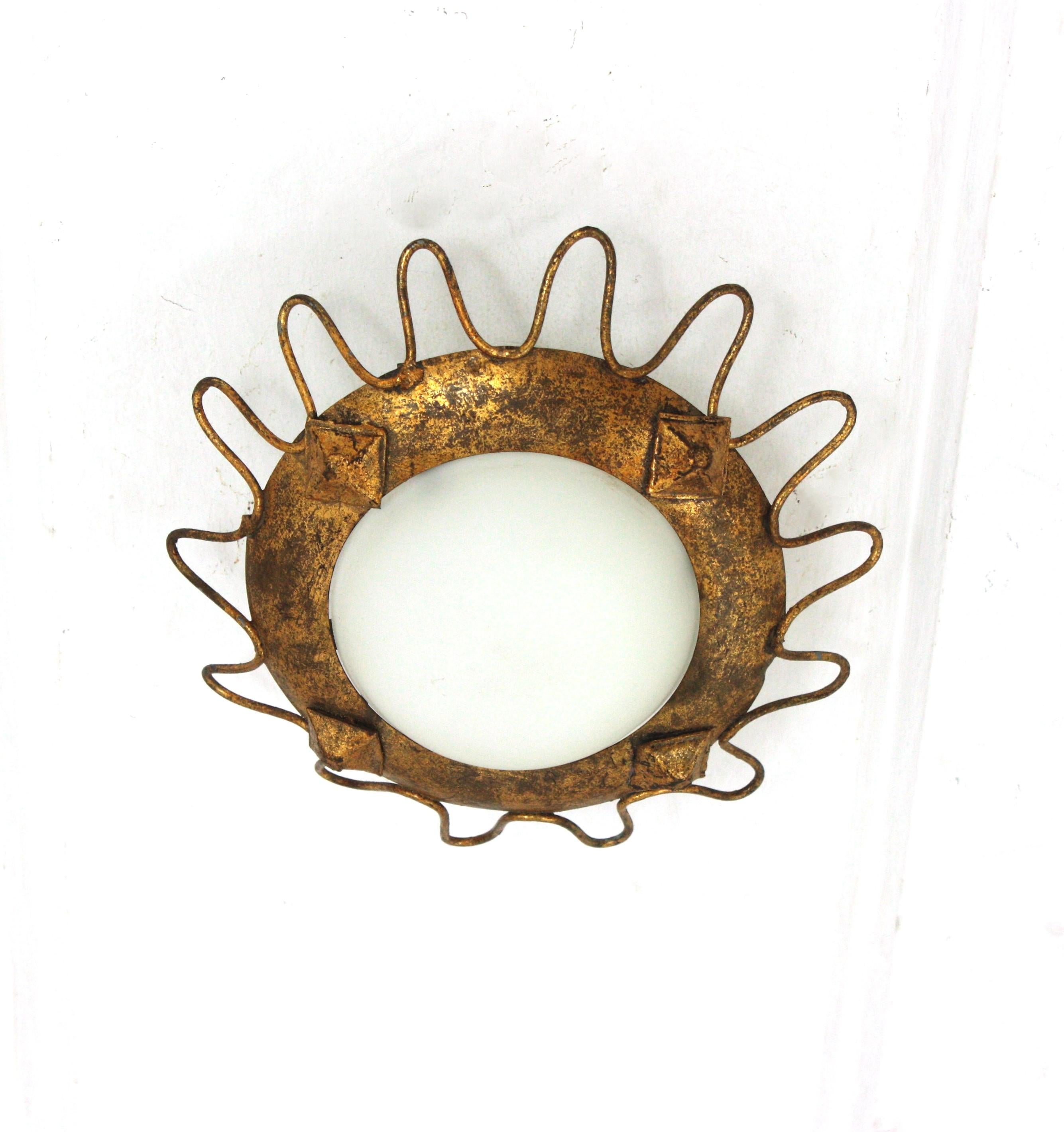 Metal Gilt Sunburst Light Fixture with Milk Glass Shade and Loop Detail For Sale