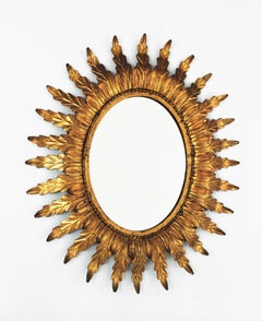 Gilt Sunburst Oval Mirror with Foliage Frame