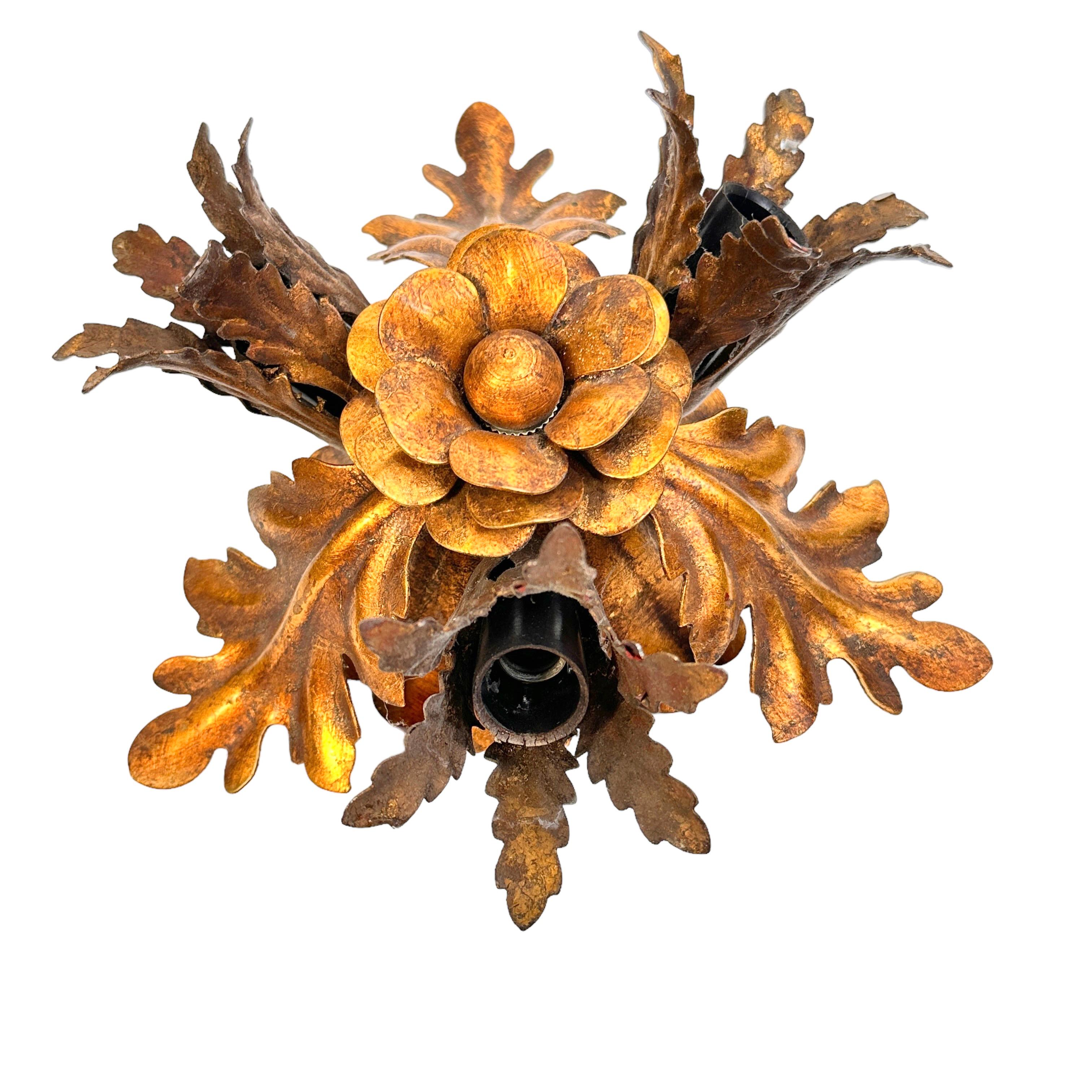 Add a touch of opulence to your home with this charming flush mount light. Perfect stunning gilt leaf and flower design to enhance any chic or eclectic home. We'd love to see it hanging in an entryway as a charming welcome home. You can also use it
