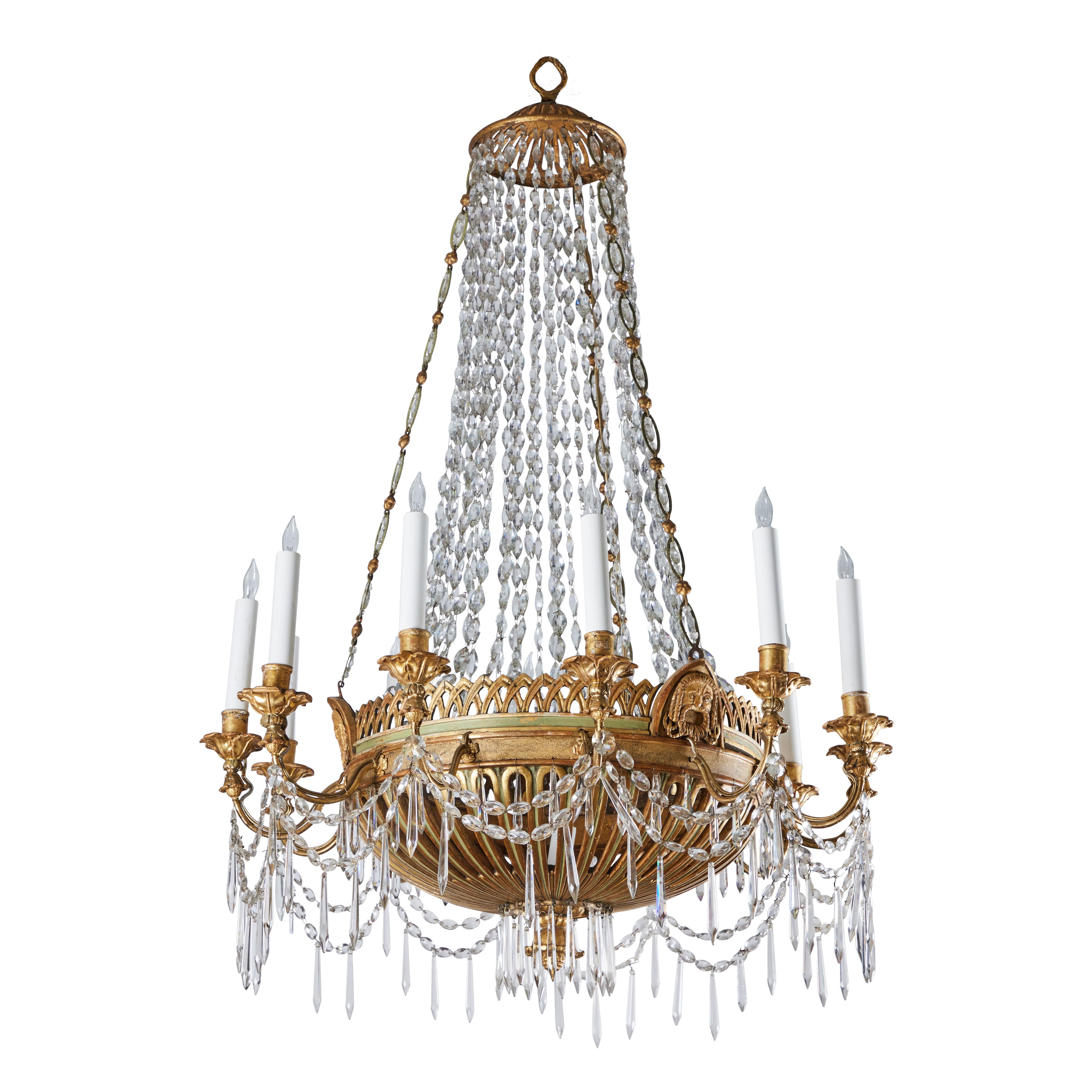 A rare, carved wood, painted, gilded and crystal chandelier.  12 candles and 1 center light. Chain of metal rings and gilt-wood spheres, gilt-wood cap. From the area of Genoa, Italy.  
