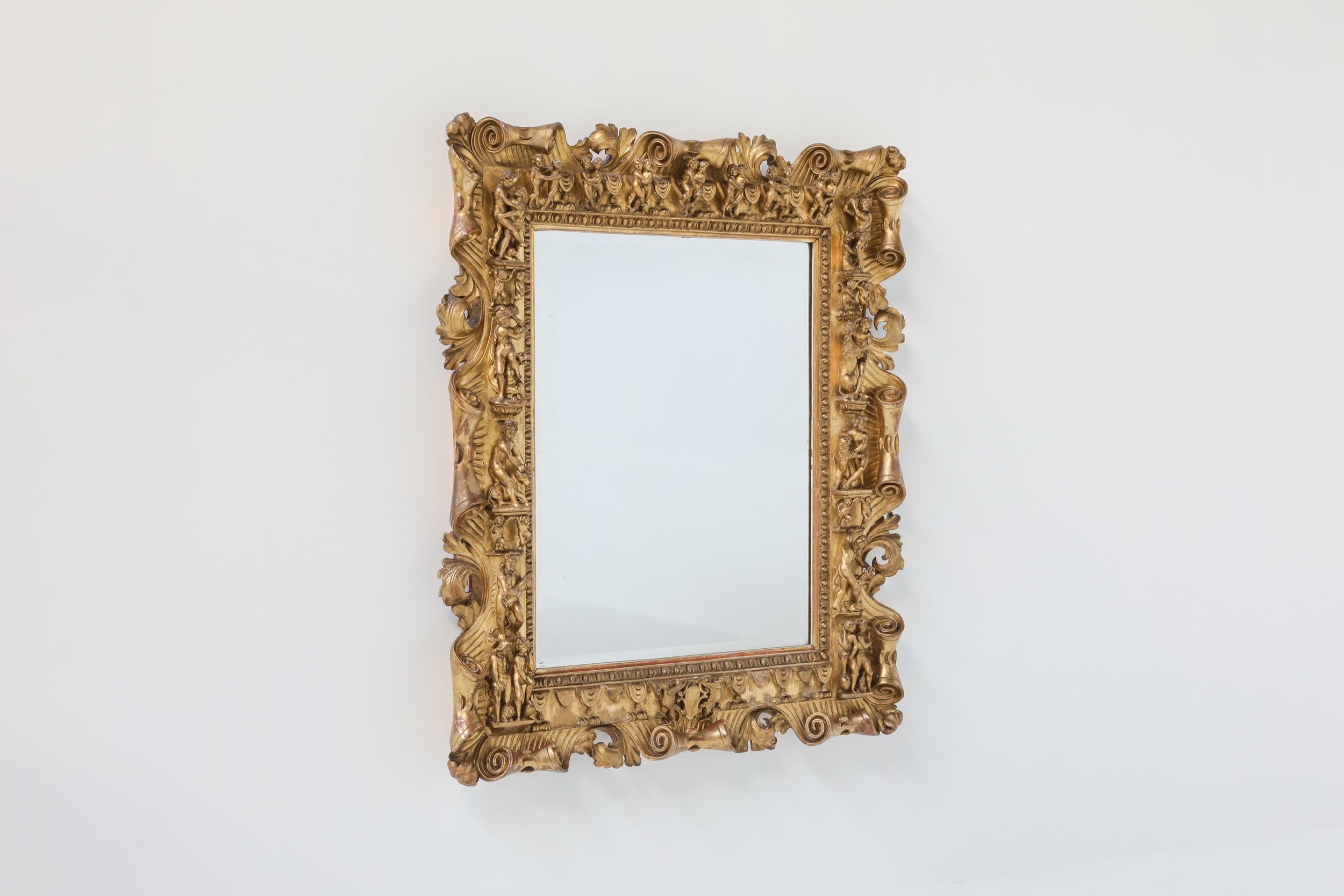 French Louis XV-style; carved giltwood wall mirror; Antique; Rococo; 

Giltwood canvas antique mirror from the 19th century. A very remarkable piece of craftsmanship made in France. In the style of Louis XV, this piece reminds us of the rococo. It