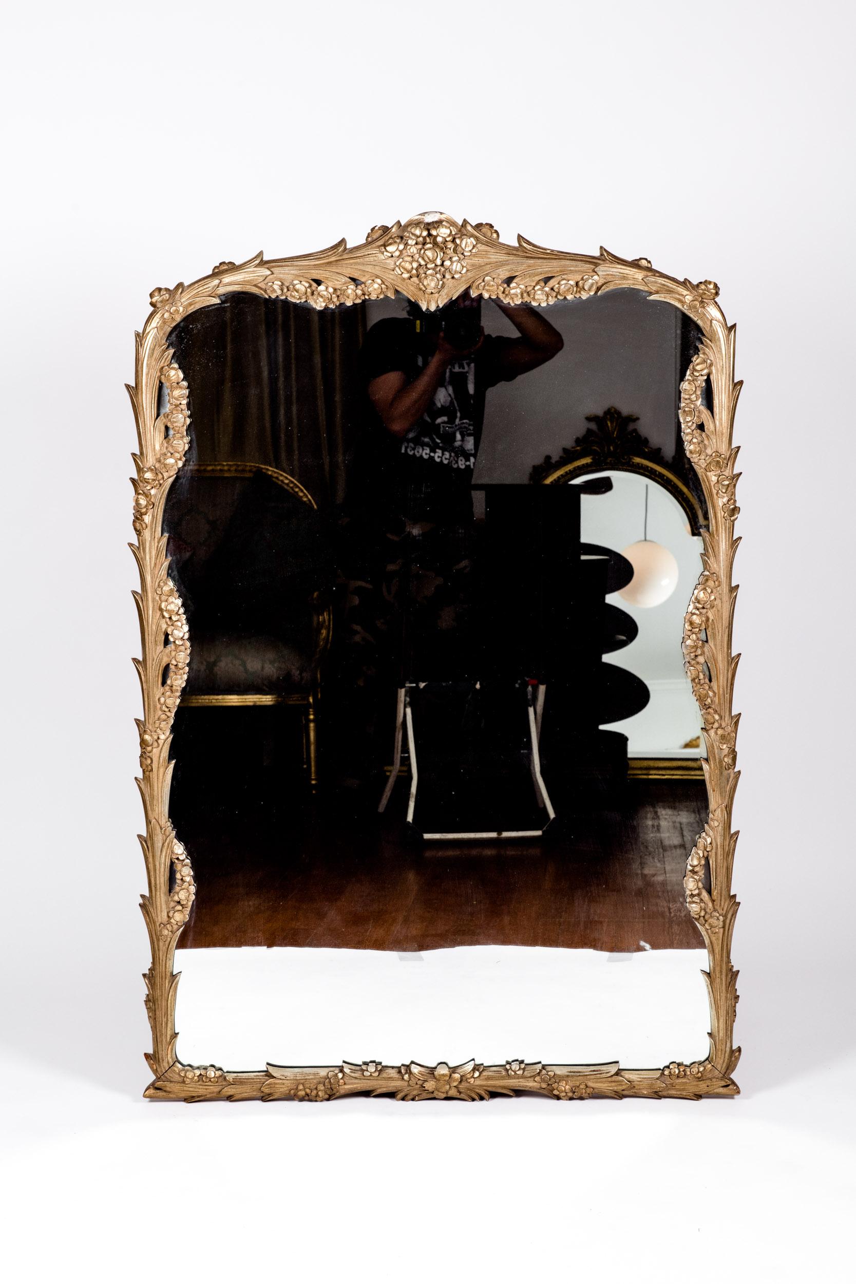 Giltwood frame mantel / fire place hanging wall mirror. The hanging wall mirror is in excellent vintage condition. Minor wear consistent with age / use . The mirror measures about 50 inches tall X 34 inches wide .