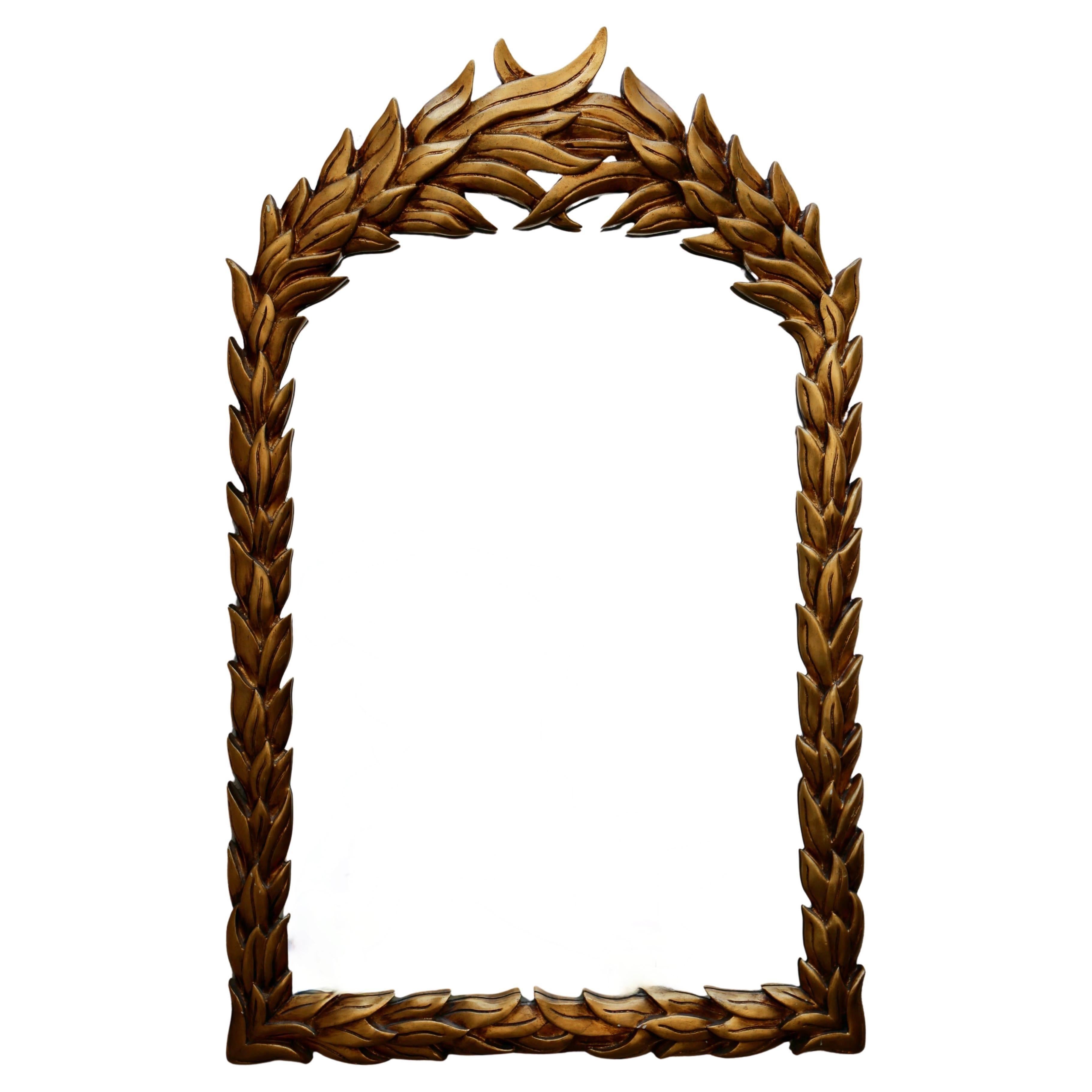  Gilt-wood frame composed of carved overlapping laurel leaves.

Condition: Minor wear and patina to the gilt finish.