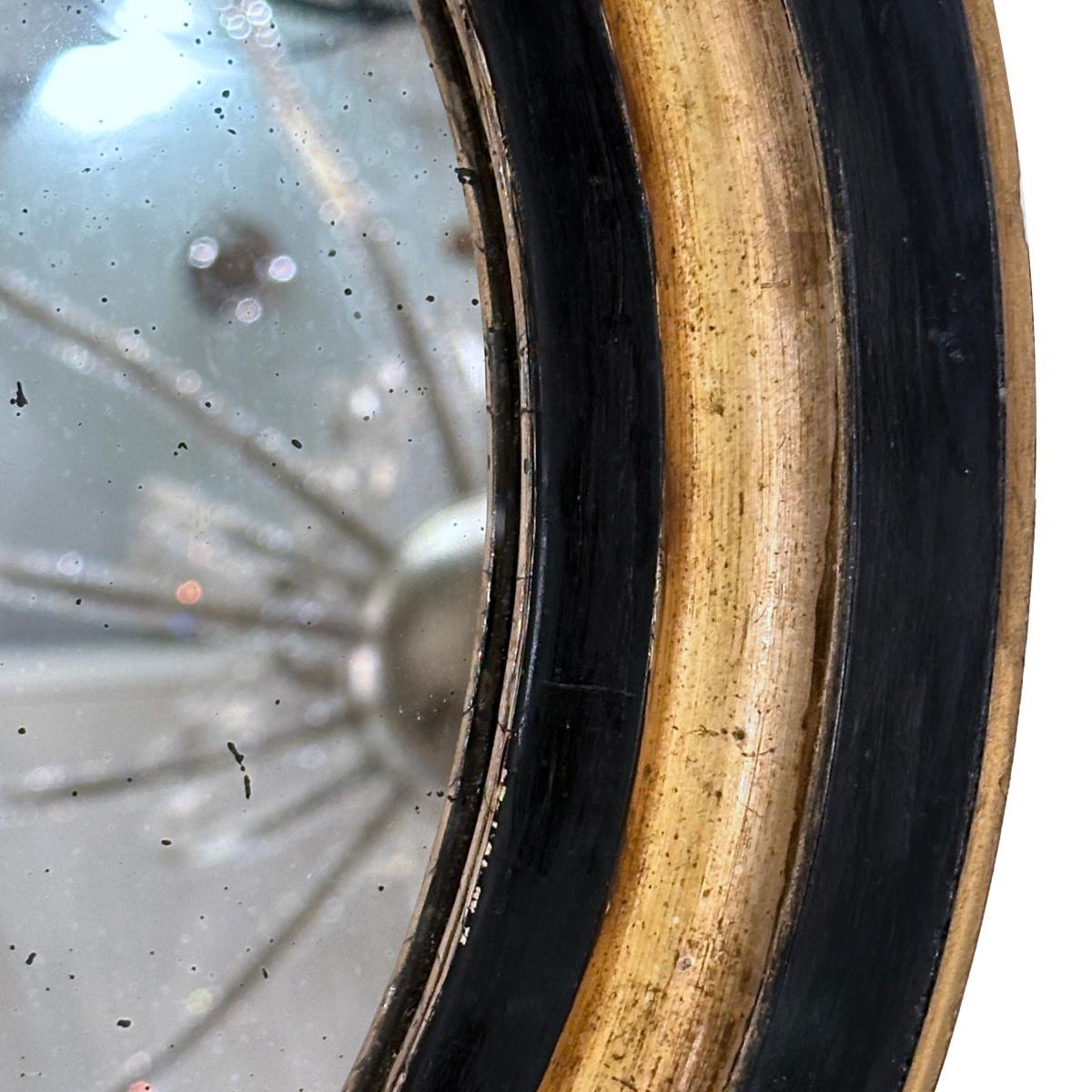 Metà XX secolo Specchio ovale in legno dorato in vendita