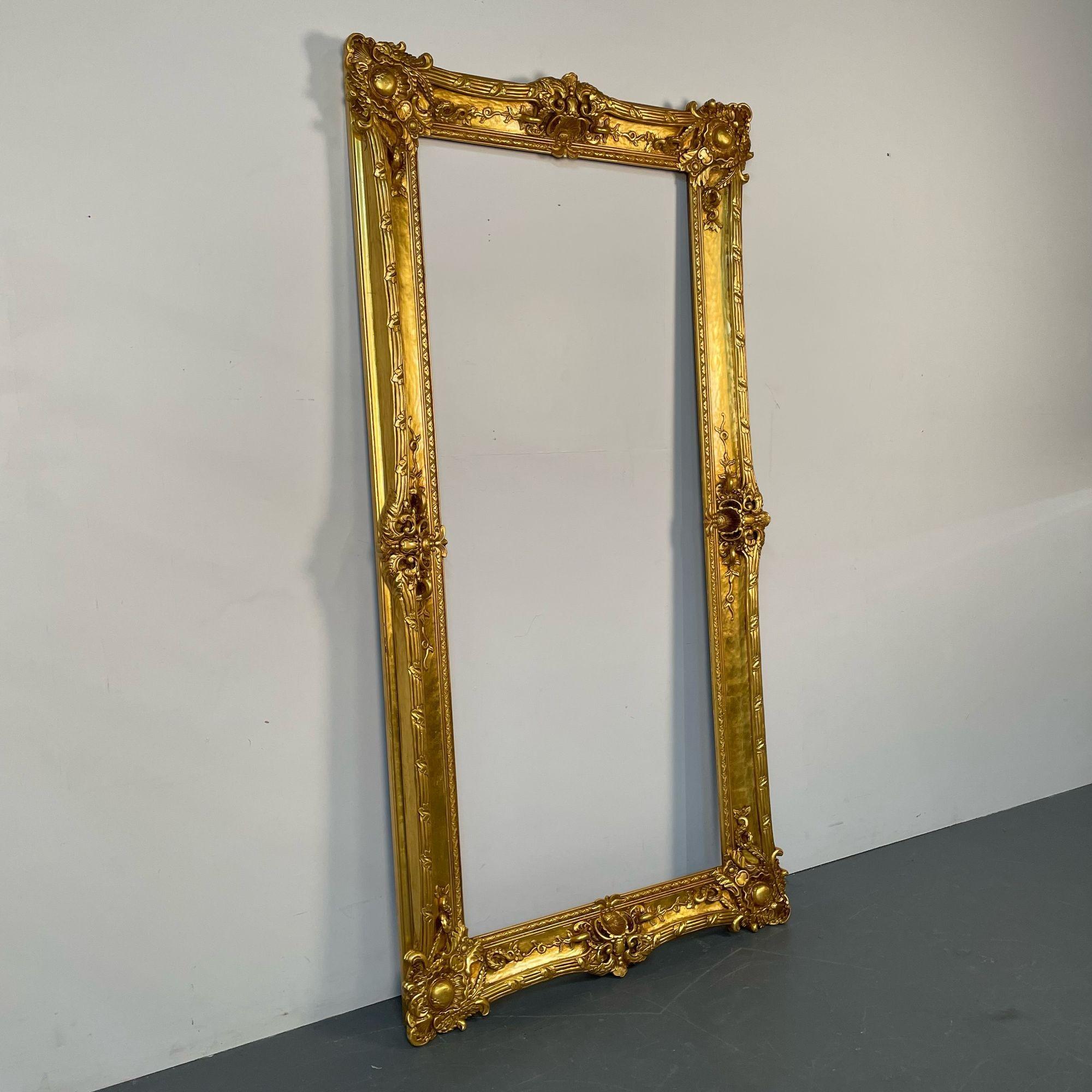 Giltwood Painting, Mirror or Picture Frame, Monumental, Carved
 
A finely carved picture or art frame having a empty center which can accommodate a mirror or a painting or picture. The frame is stunning with carved roses, scroll and leaf design in
